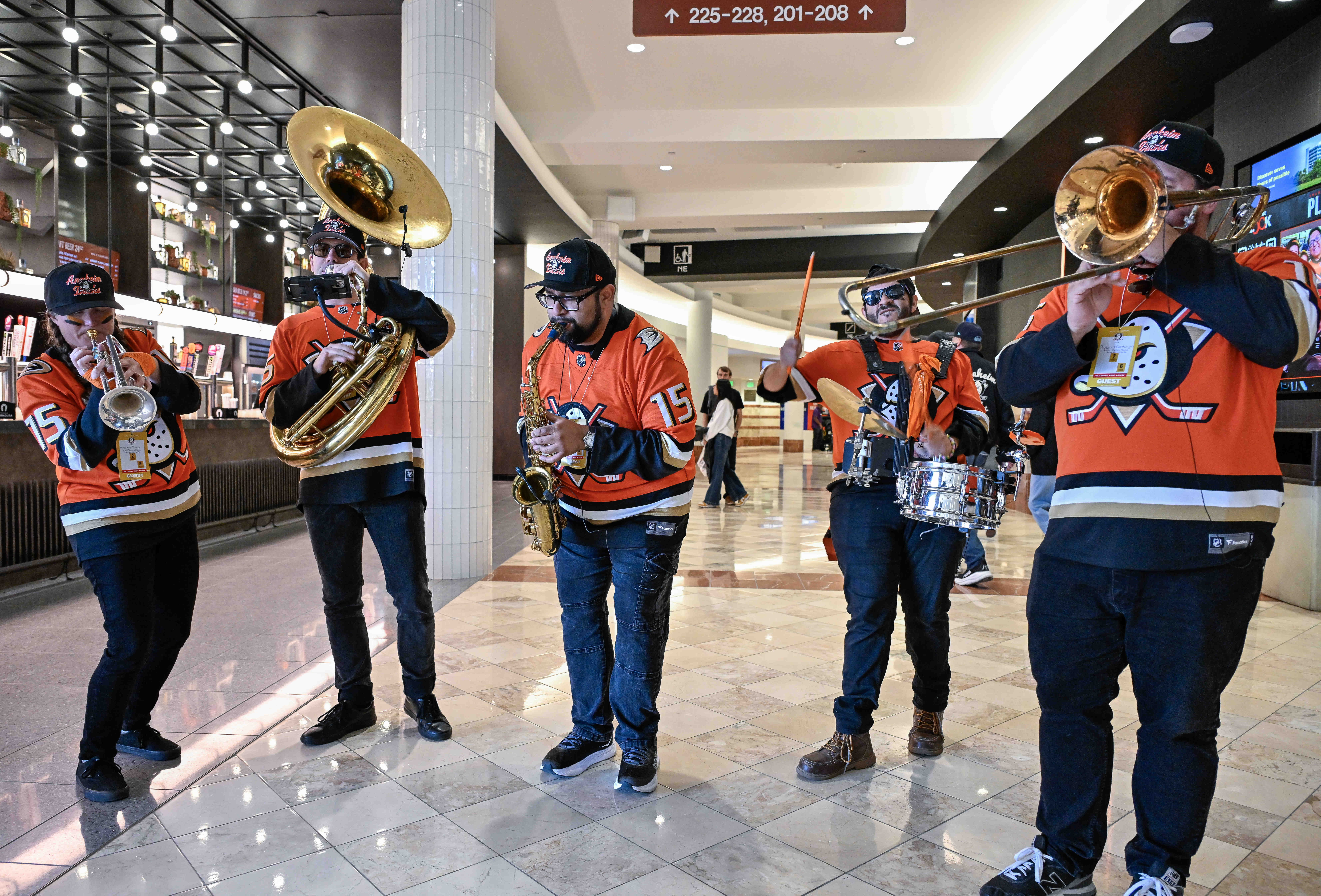 Members of Bear Brass perform for fans on their way...