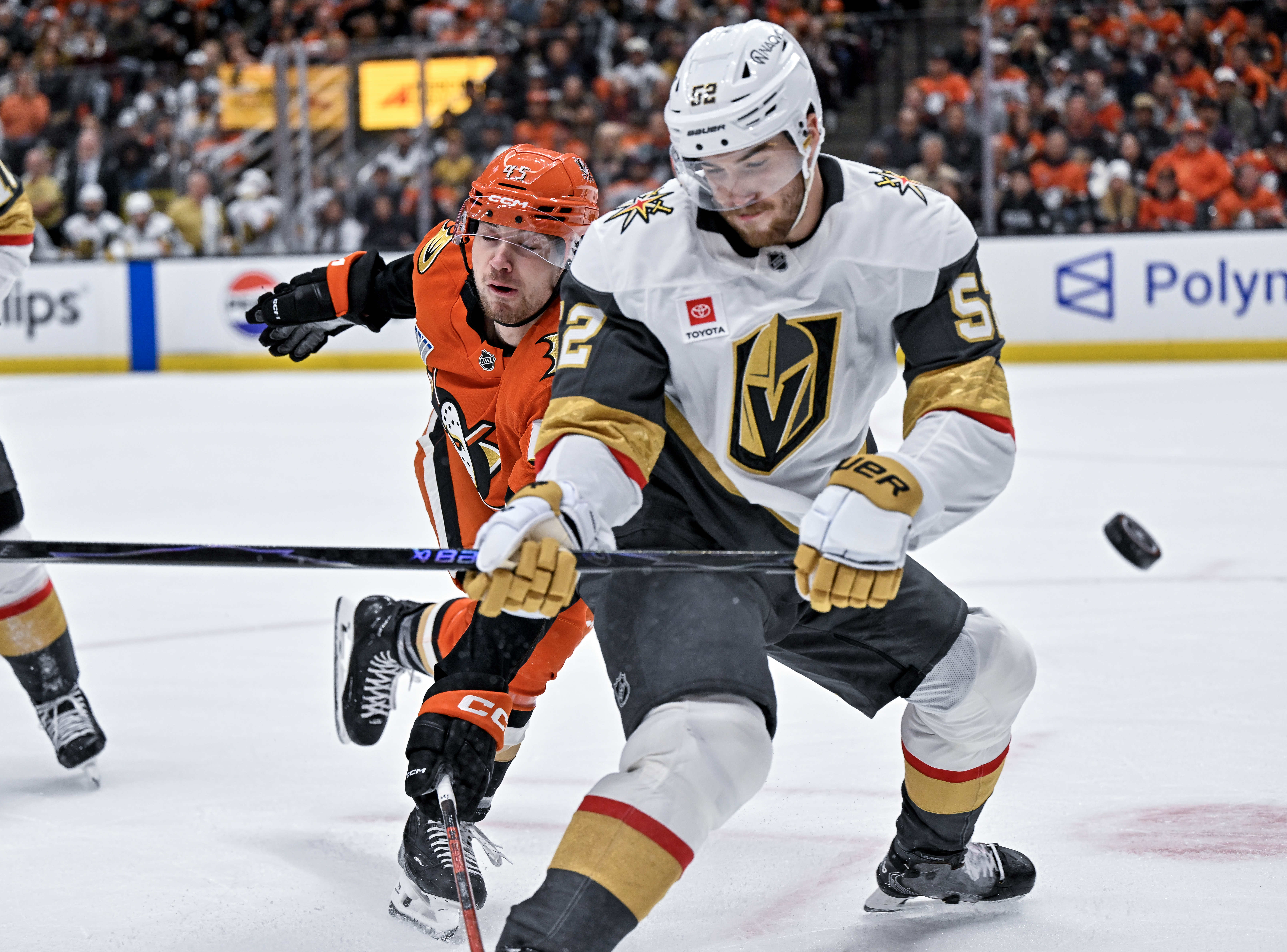 The Vegas Golden Knightsâ Dylan Coghlan, right, and the Ducksâ...