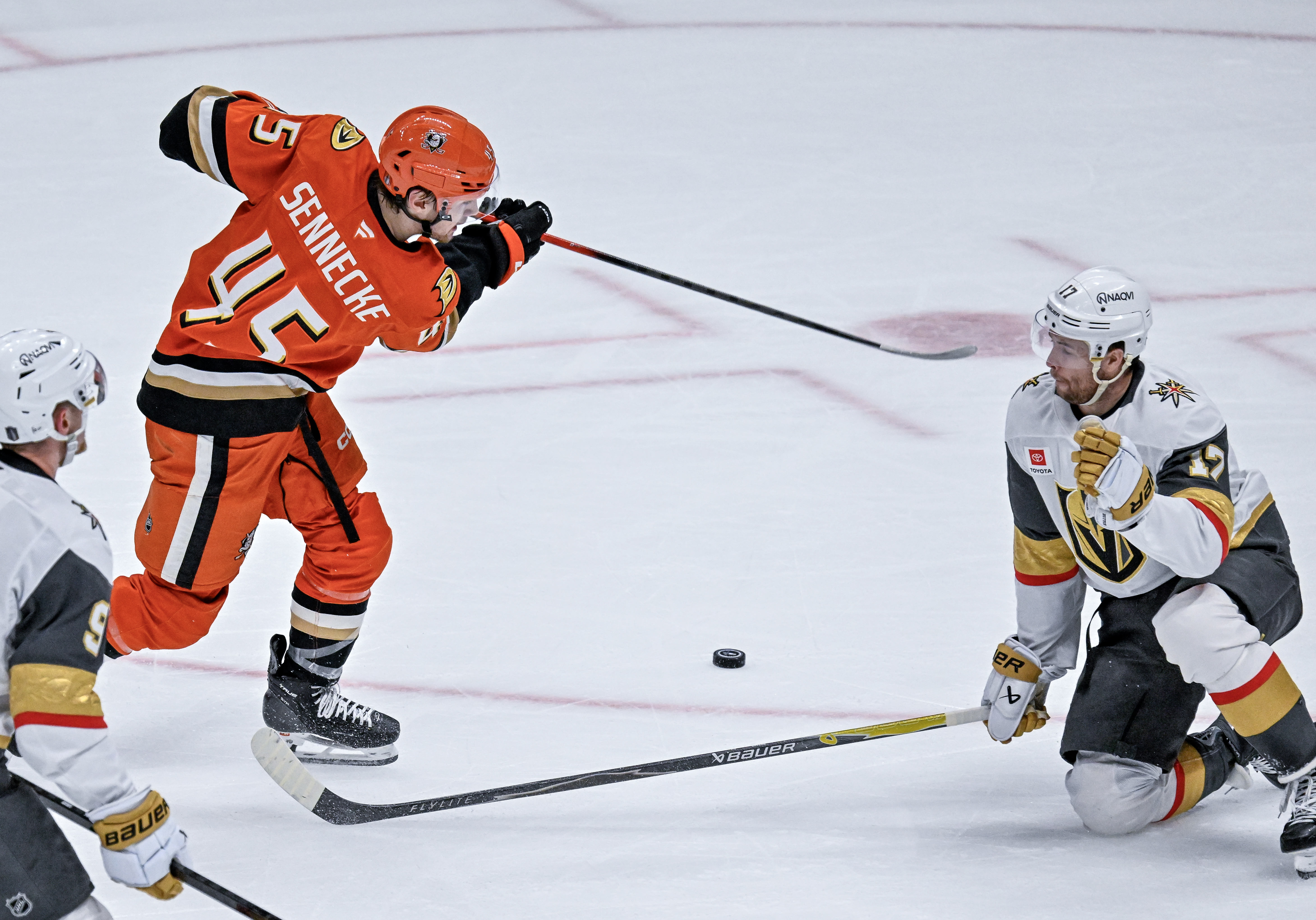 The Ducksâ Beckett Sennecke, left, takes a shot on goal,...