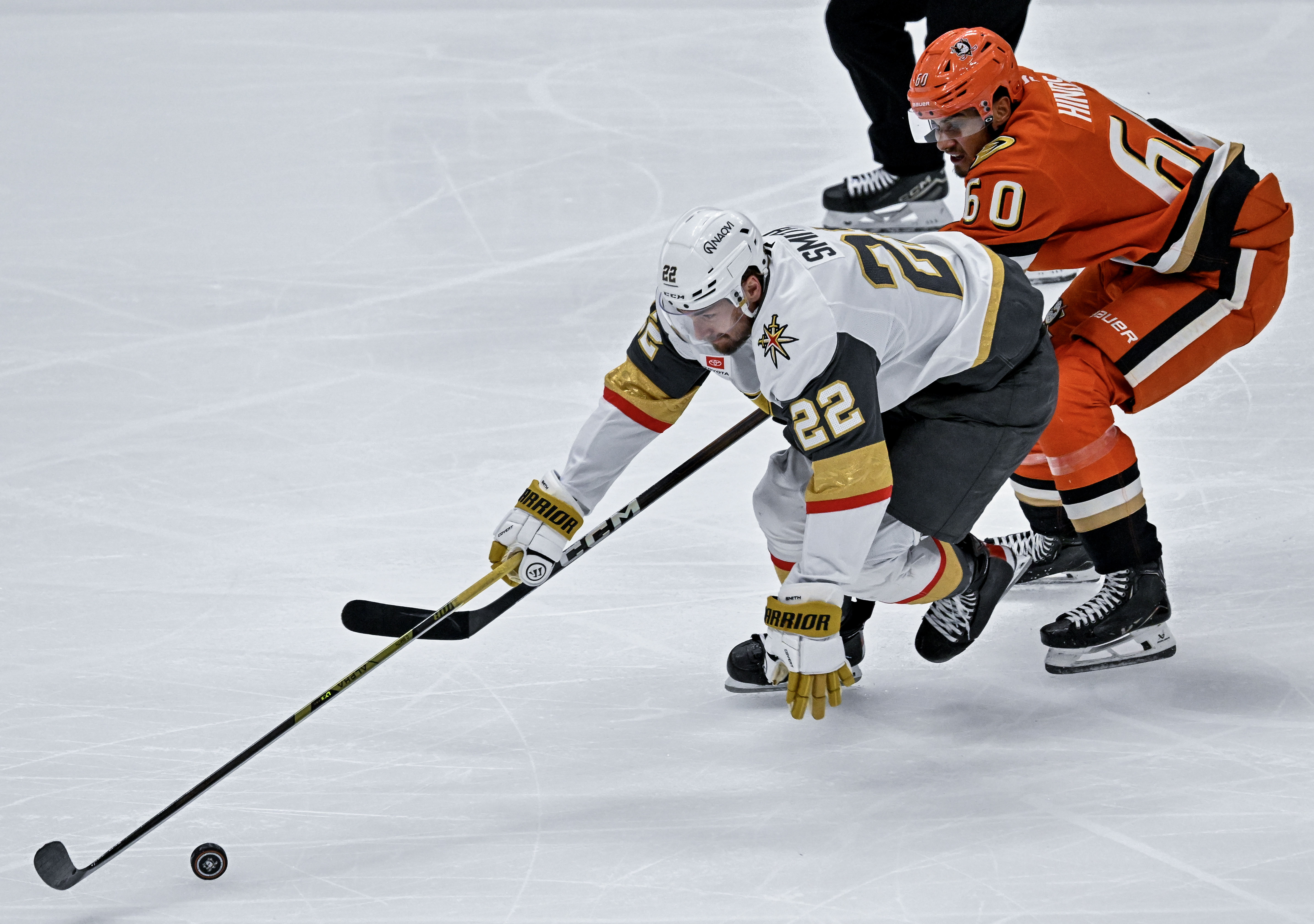 The Golden Knightsâ Cole Smith (22) controls the puck on...