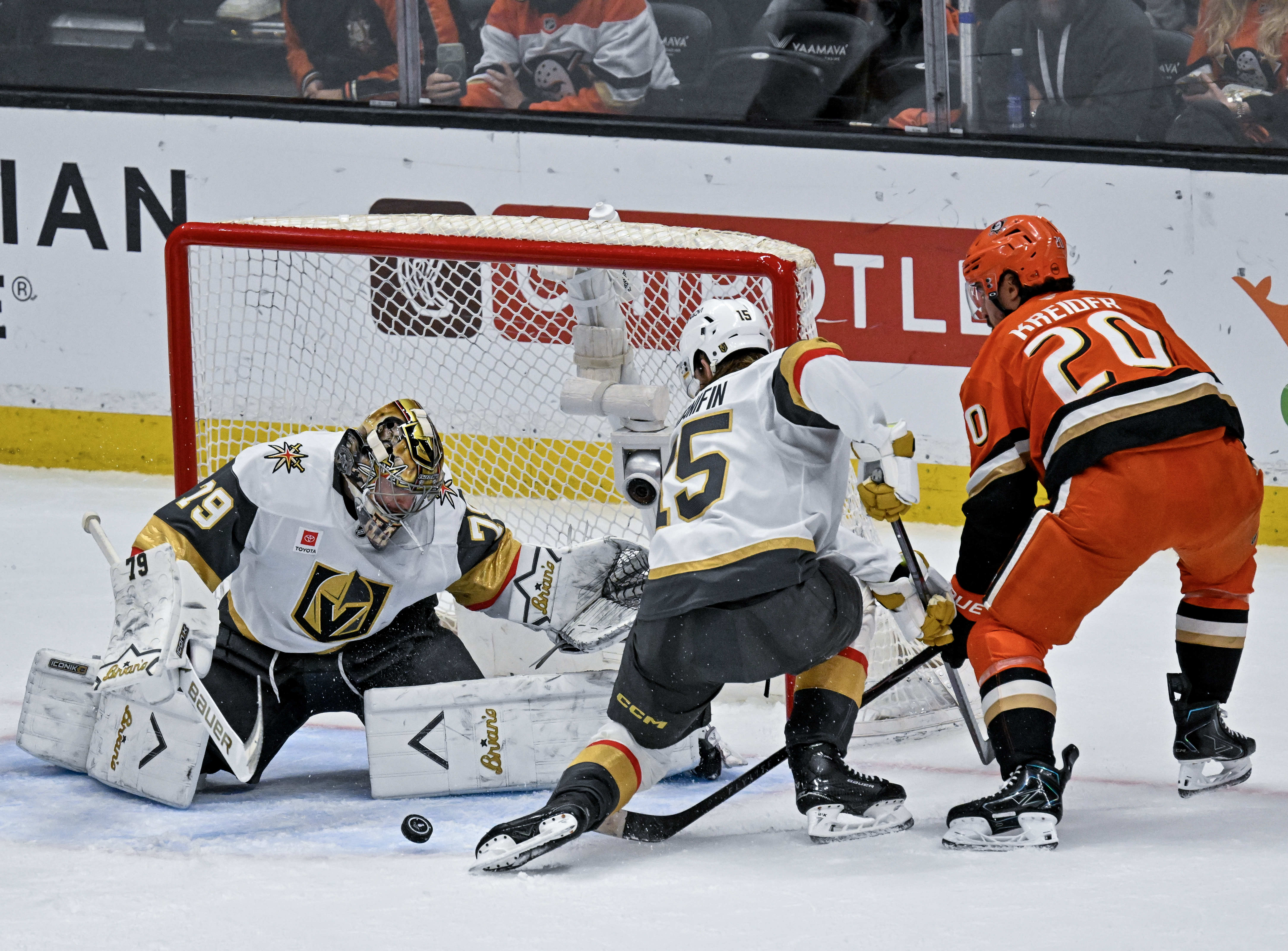 The Ducksâ Chris Kreider (20), right, takes a shot on...