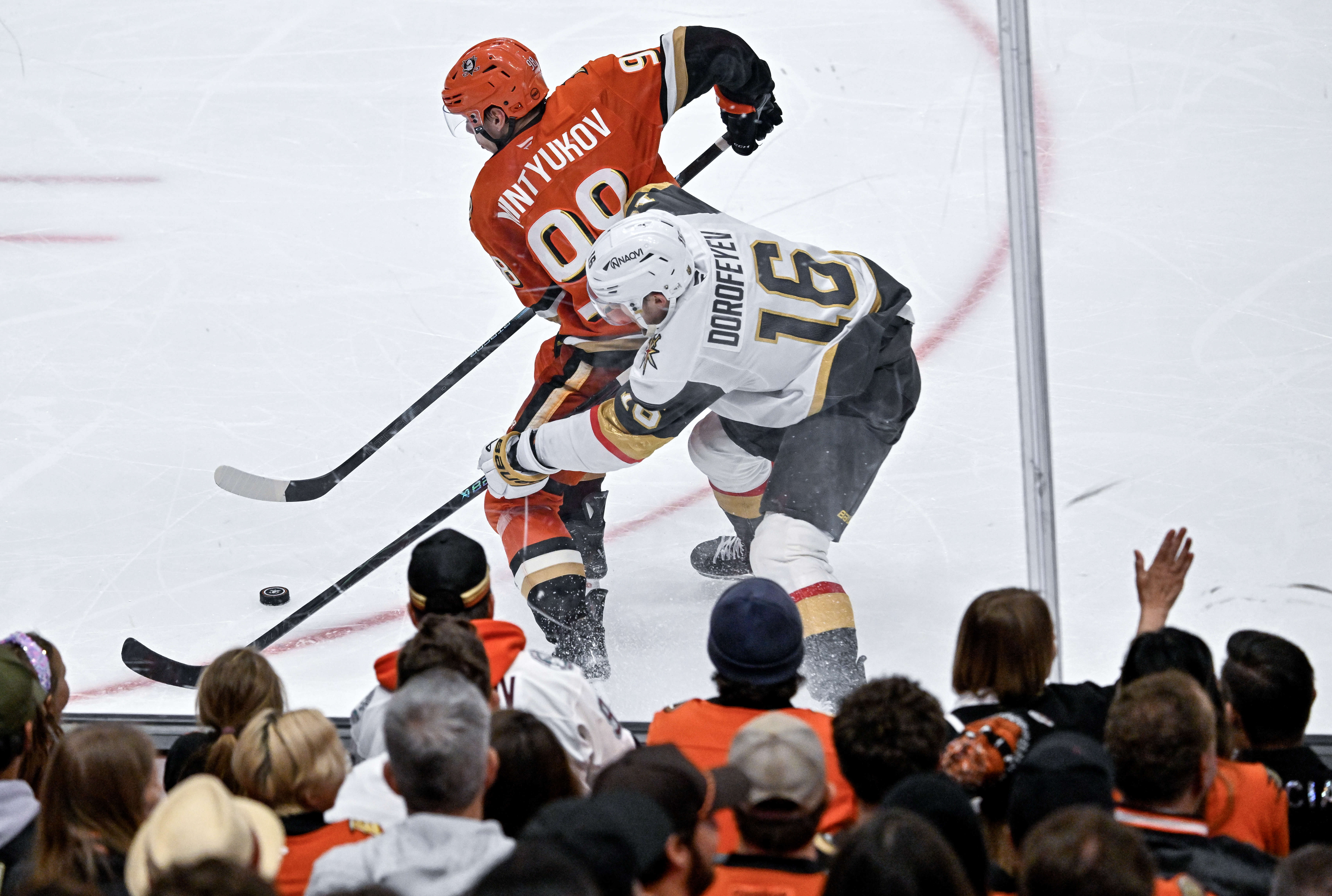 The Ducksâ Pavel Mintyukov (98), left, and the Golden Knightsâ...