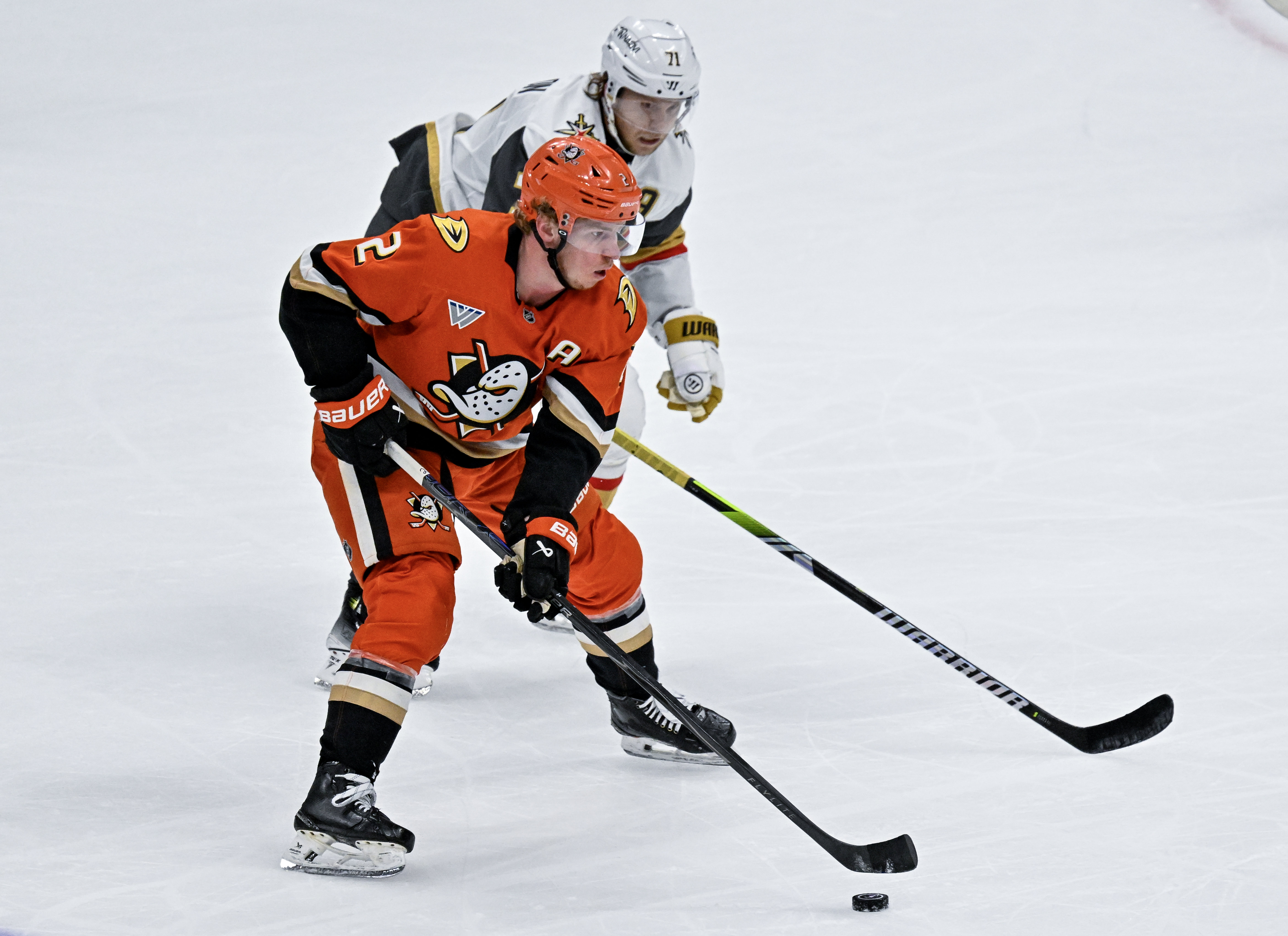 The Ducksâ Jackson LaCombe (2) controls the puck in the...