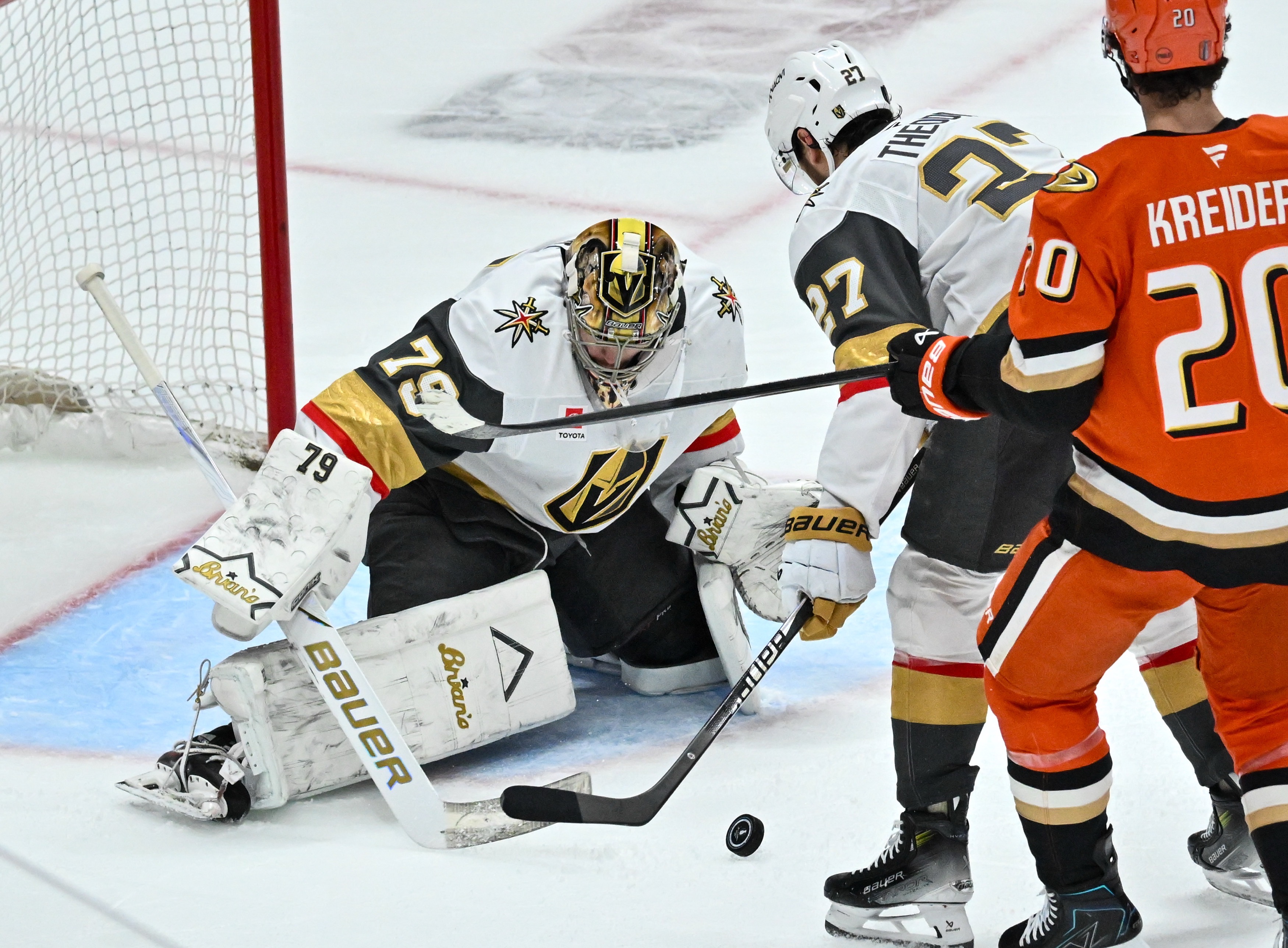 The Vegas Golden Knights Carter Hart (79) is helped by...