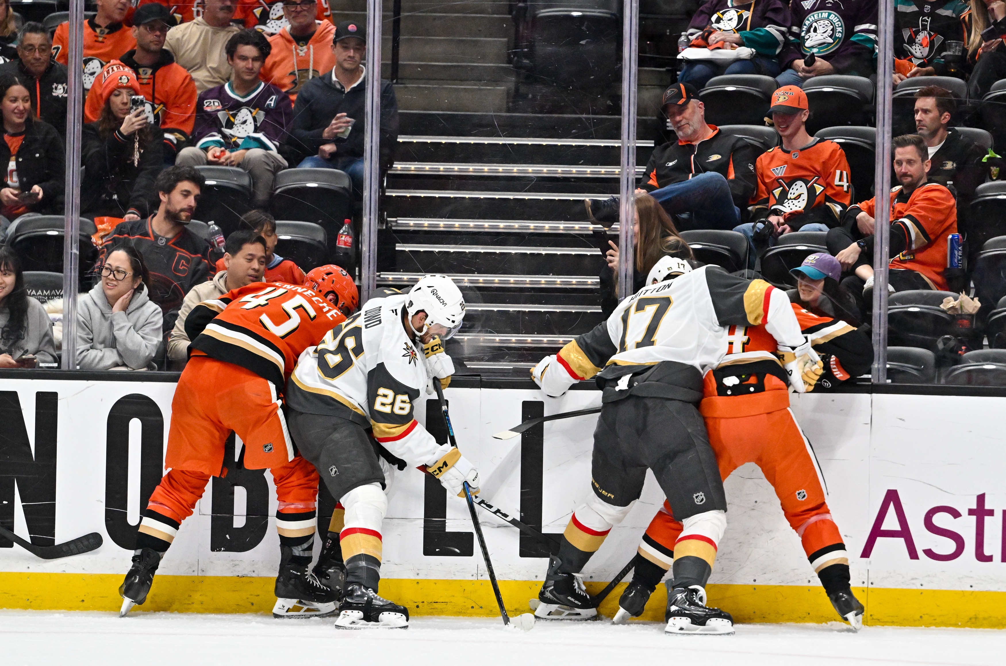 The Ducks and Vegas Golden Knights battle for the puck...