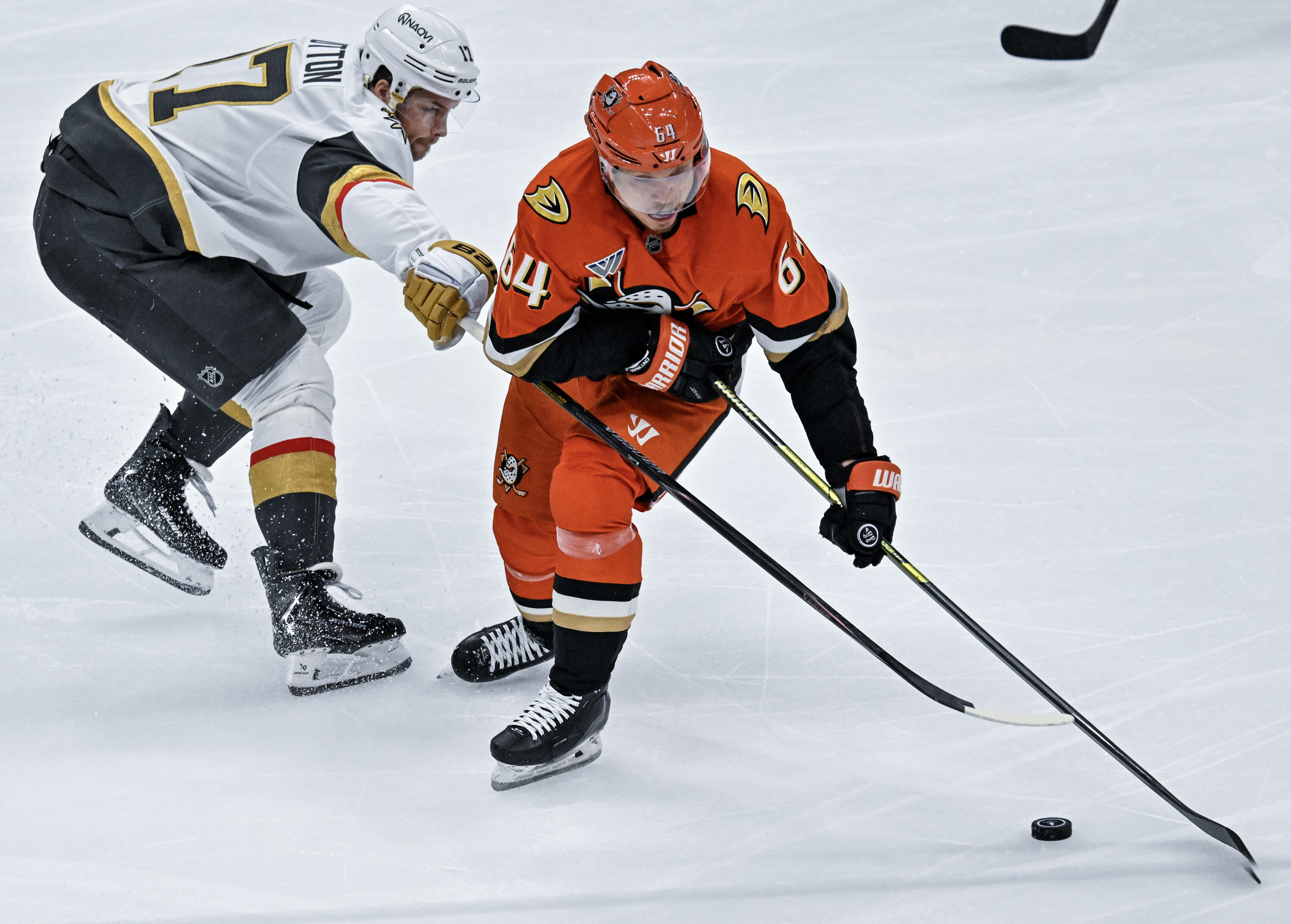 The Ducksâ Mikael Granlund (64) controls the puck during the...