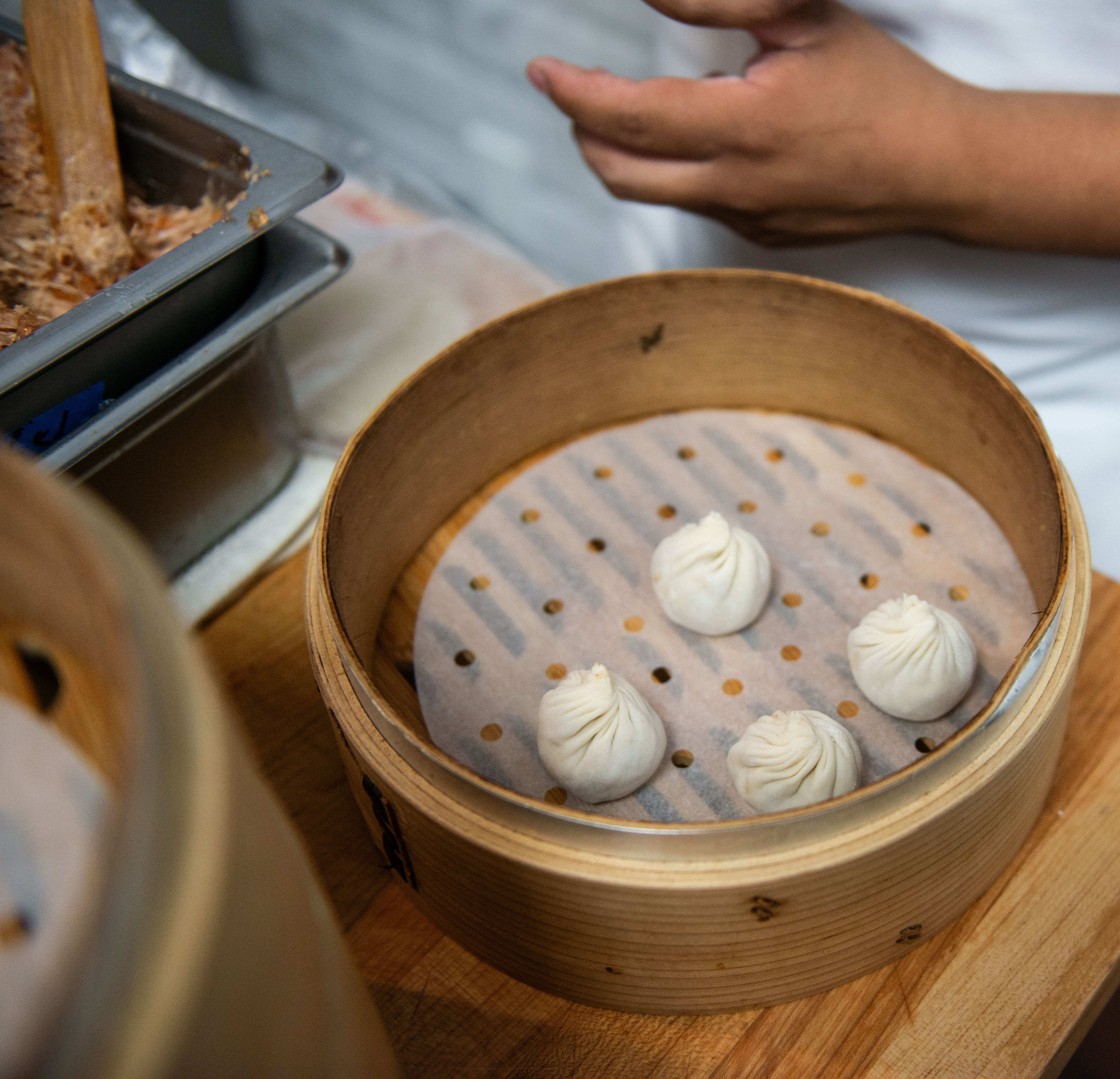 Staff prepares soup dumplings at the recently Michelin listed restaurant...