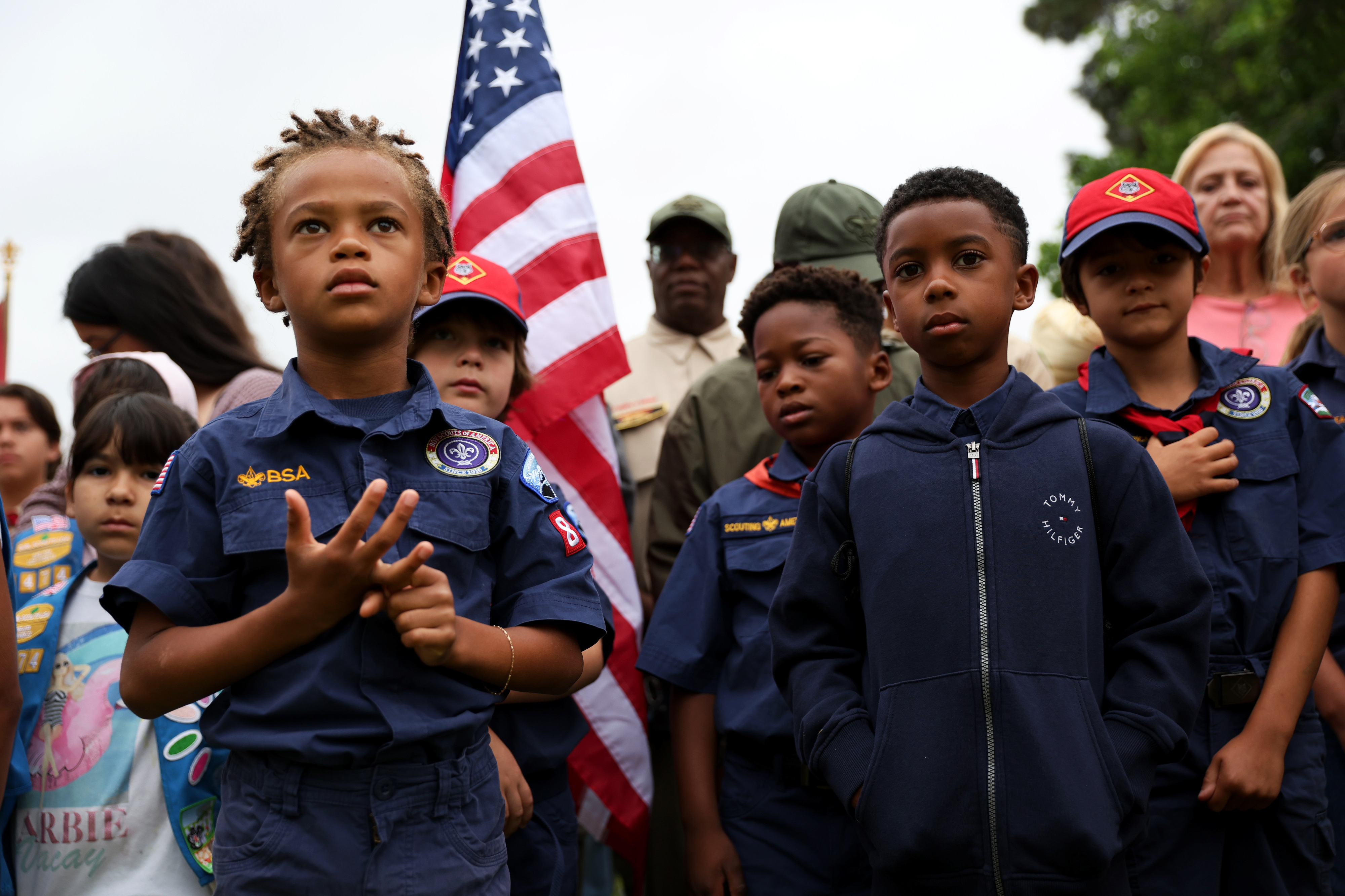 Scouts lineup together before an opening ceremony for the annual...