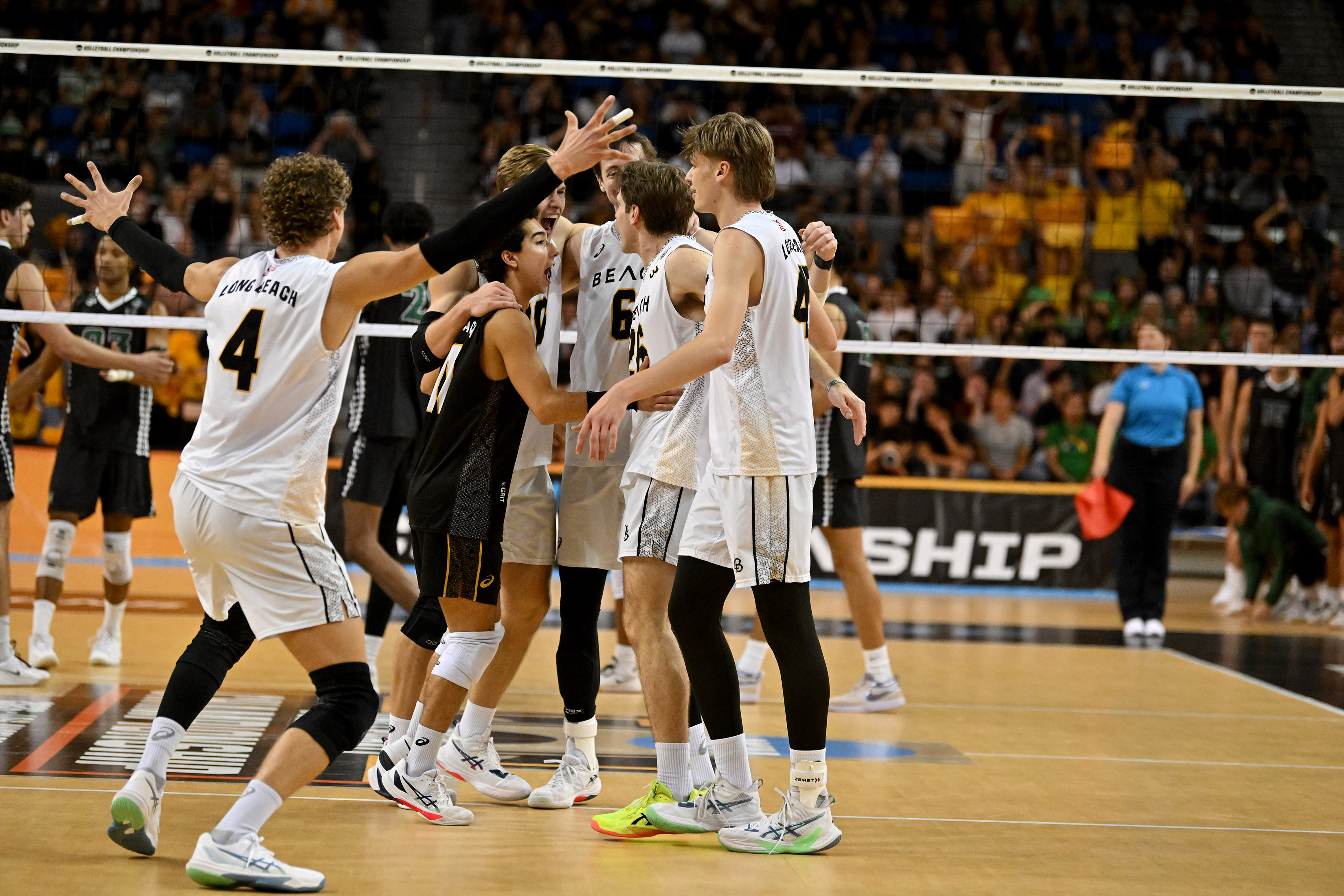 Long Beach State players celebrate a point in the NCAA...
