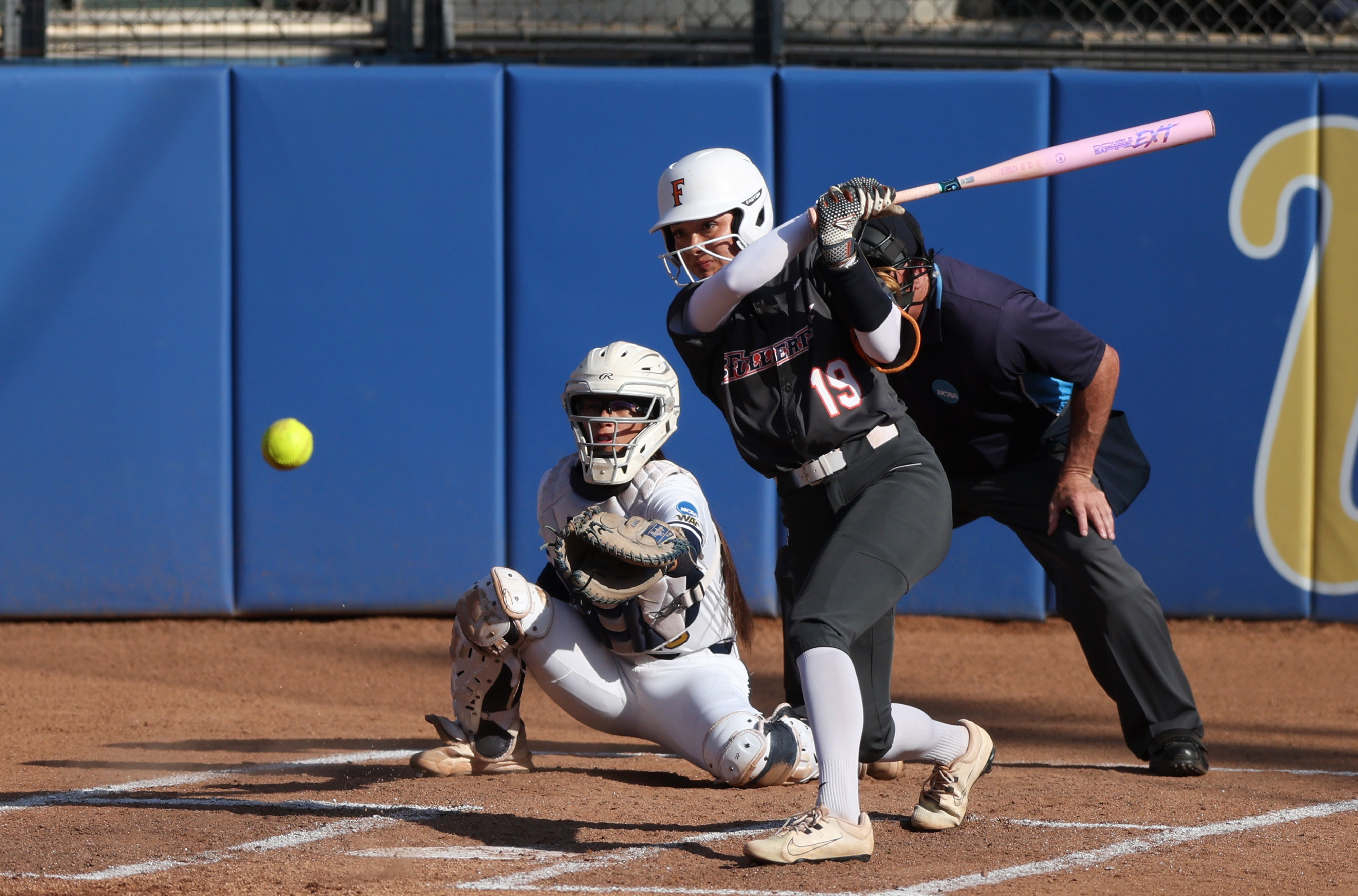 Cal State Fullertonâs Colby McClinton (19) makes contact while at-bat...