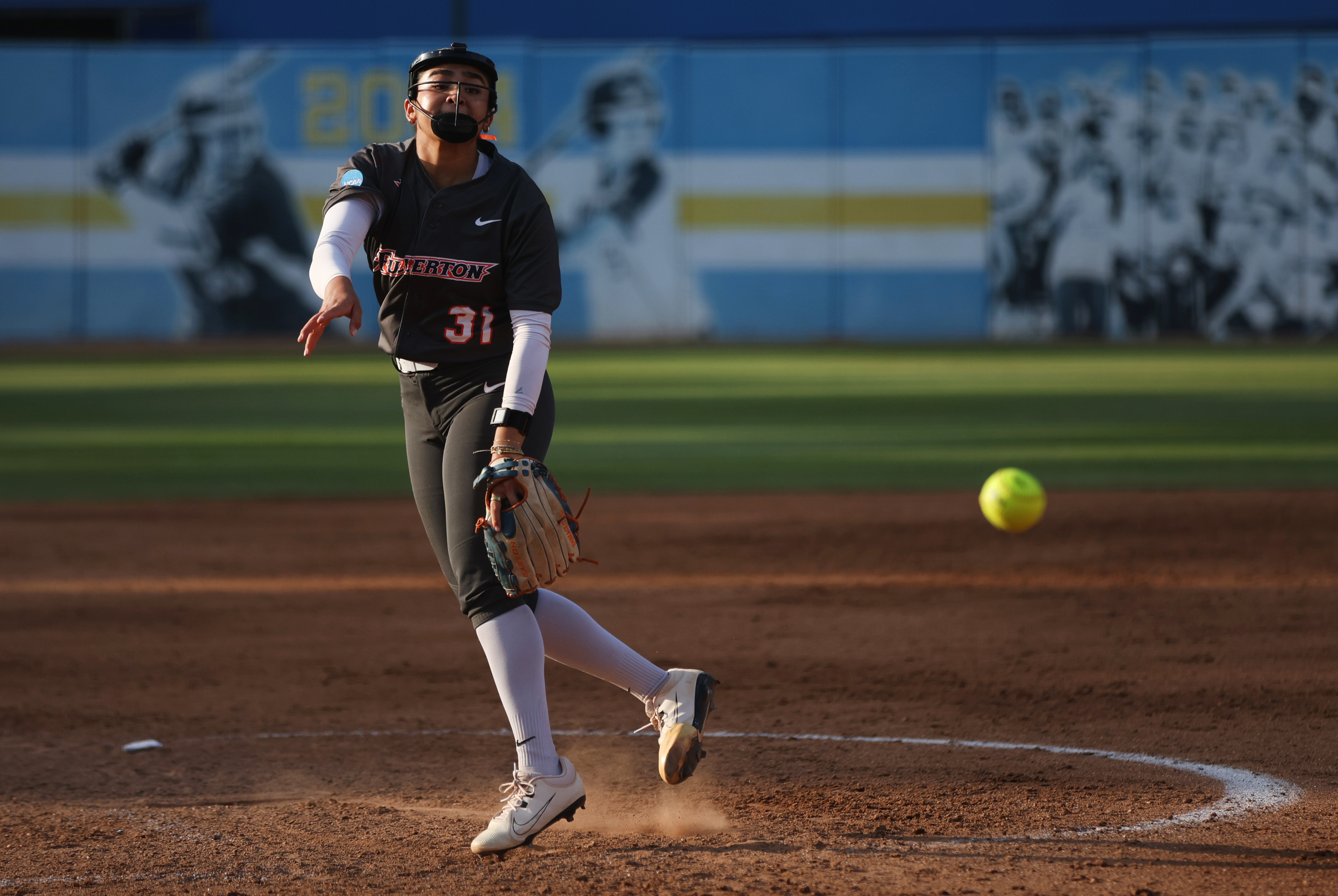 Cal State Fullertonâs Eva Hurtado (31) delivers a pitch to...