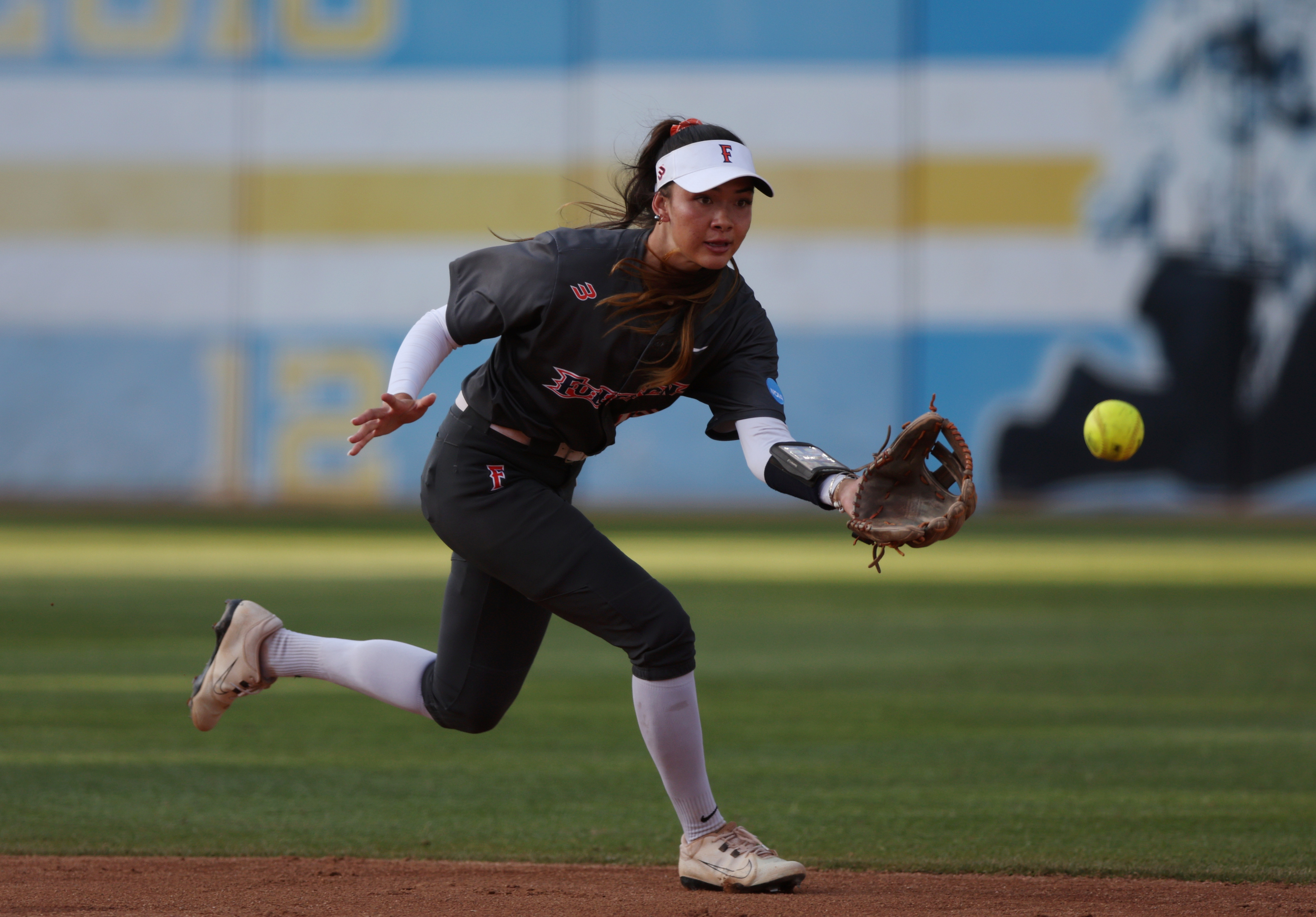 Cal State Fullertonâs Colby McClinton reaches for a hopping ground...