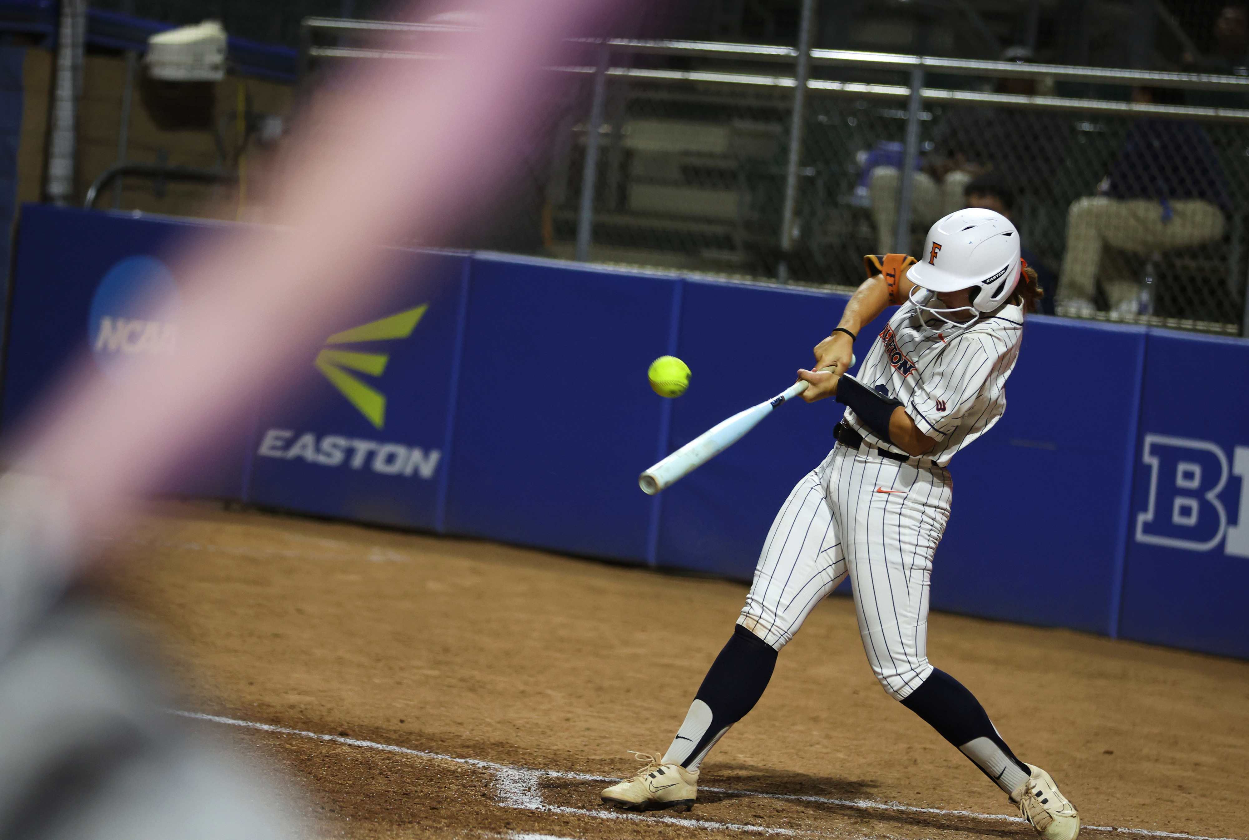 Cal State Fullertonâs Ava Arce makes contact while at-bat against...
