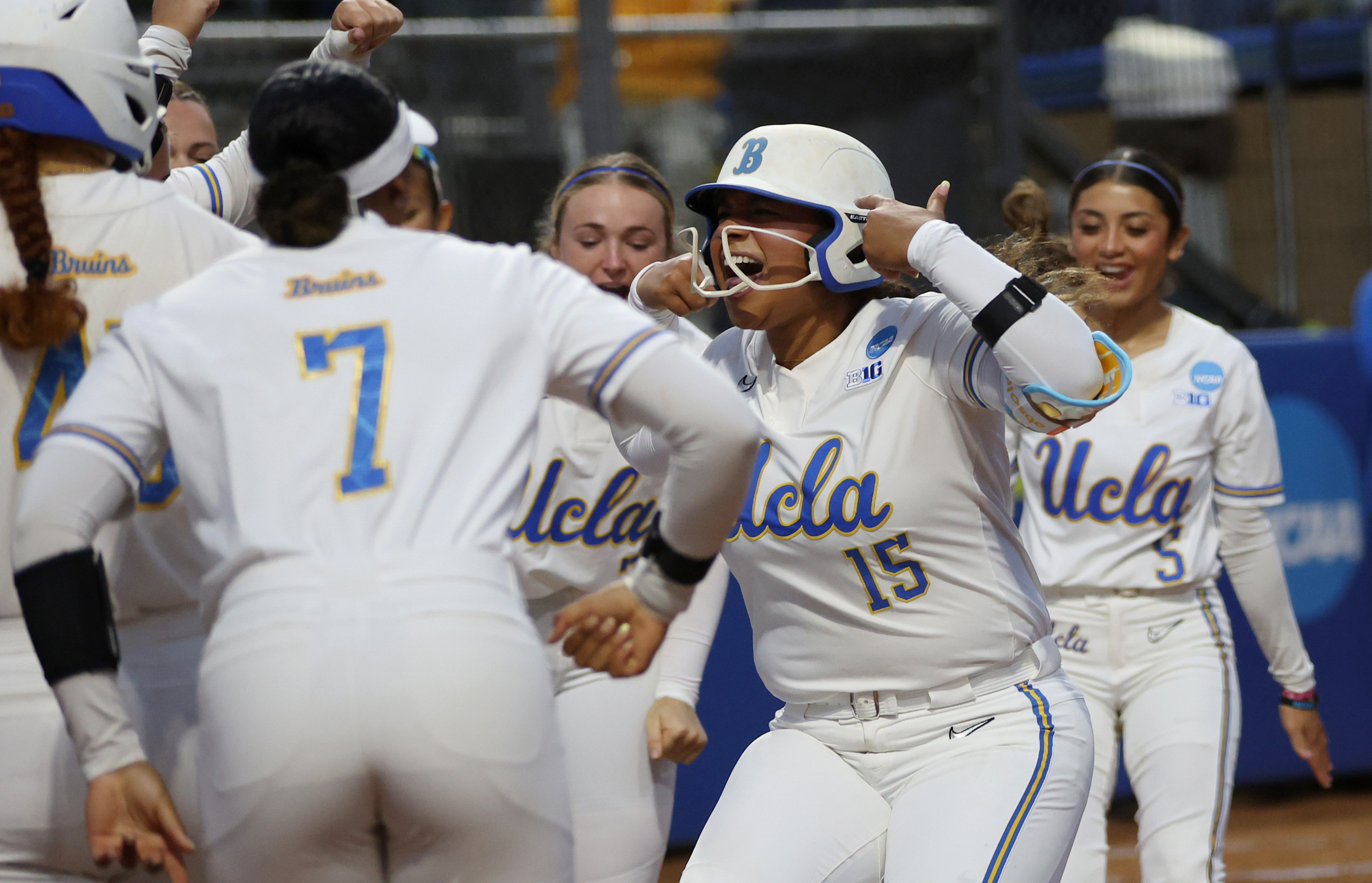UCLAâs Jordan Woolery (15) celebrates with her teammates at home...