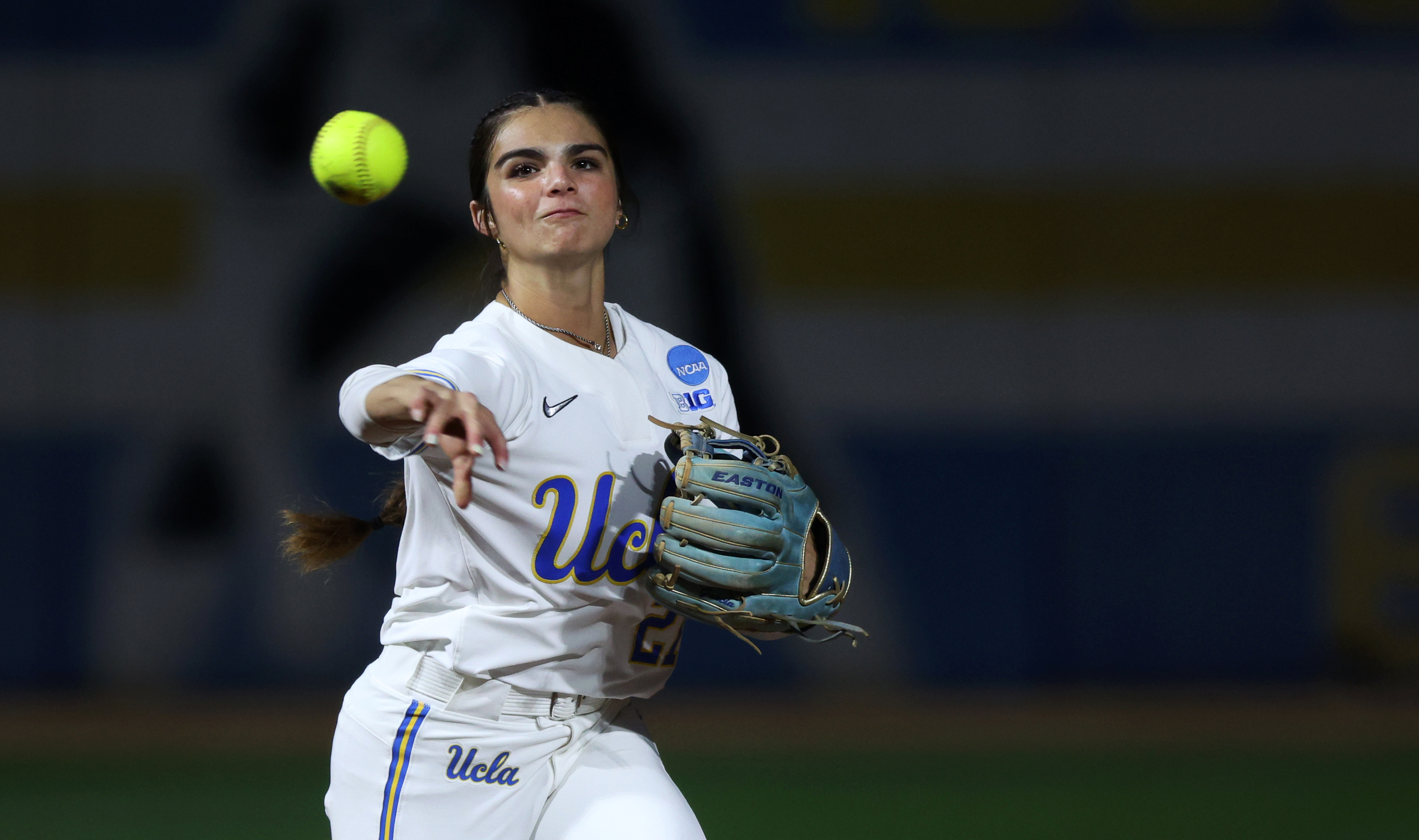 UCLAâs Aleena Garcia throws to first base after fielding a...