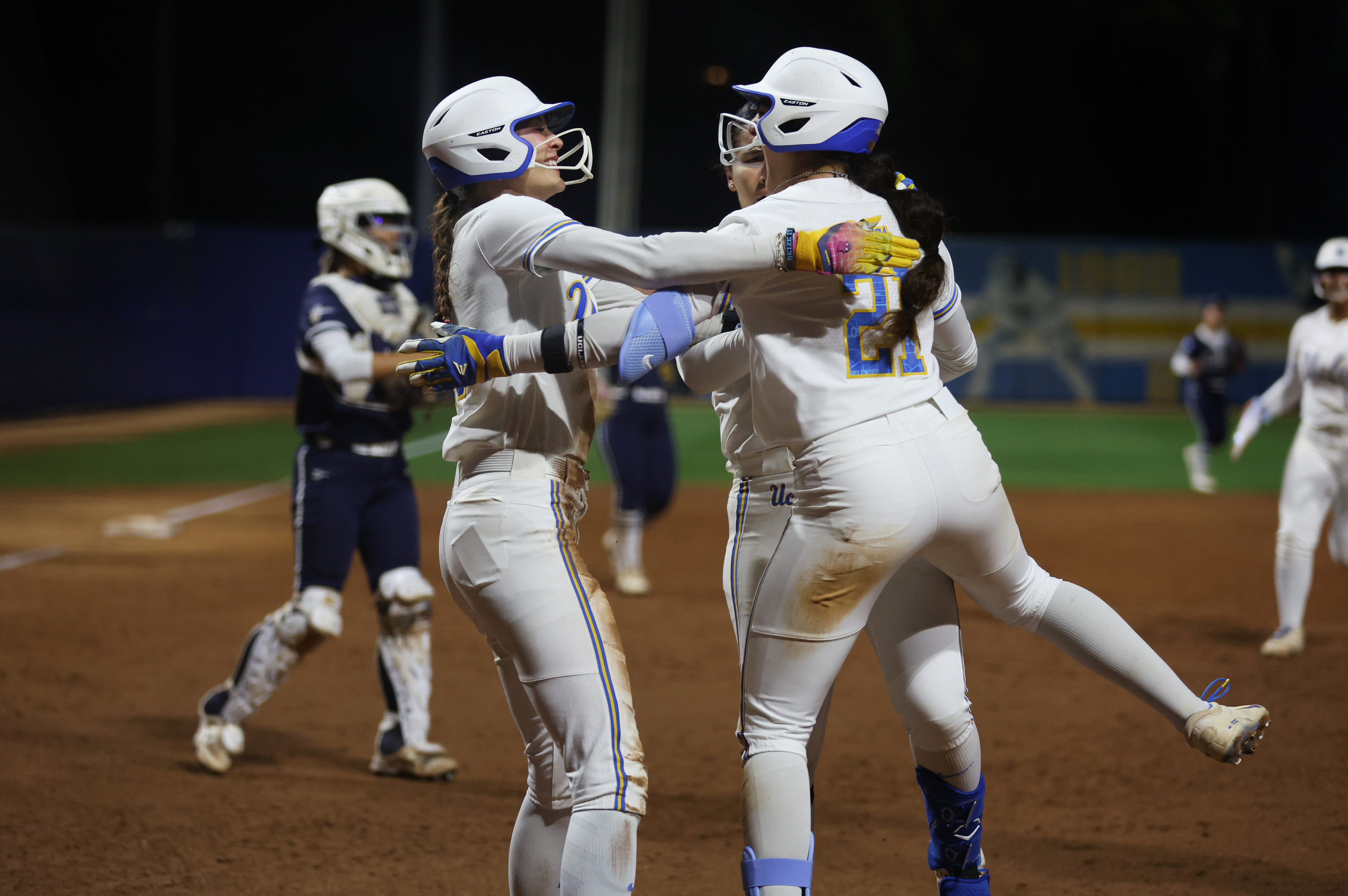 UCLAâs Rylee Slimp, center left, celebrates alongside Aleena Garcia (21)...