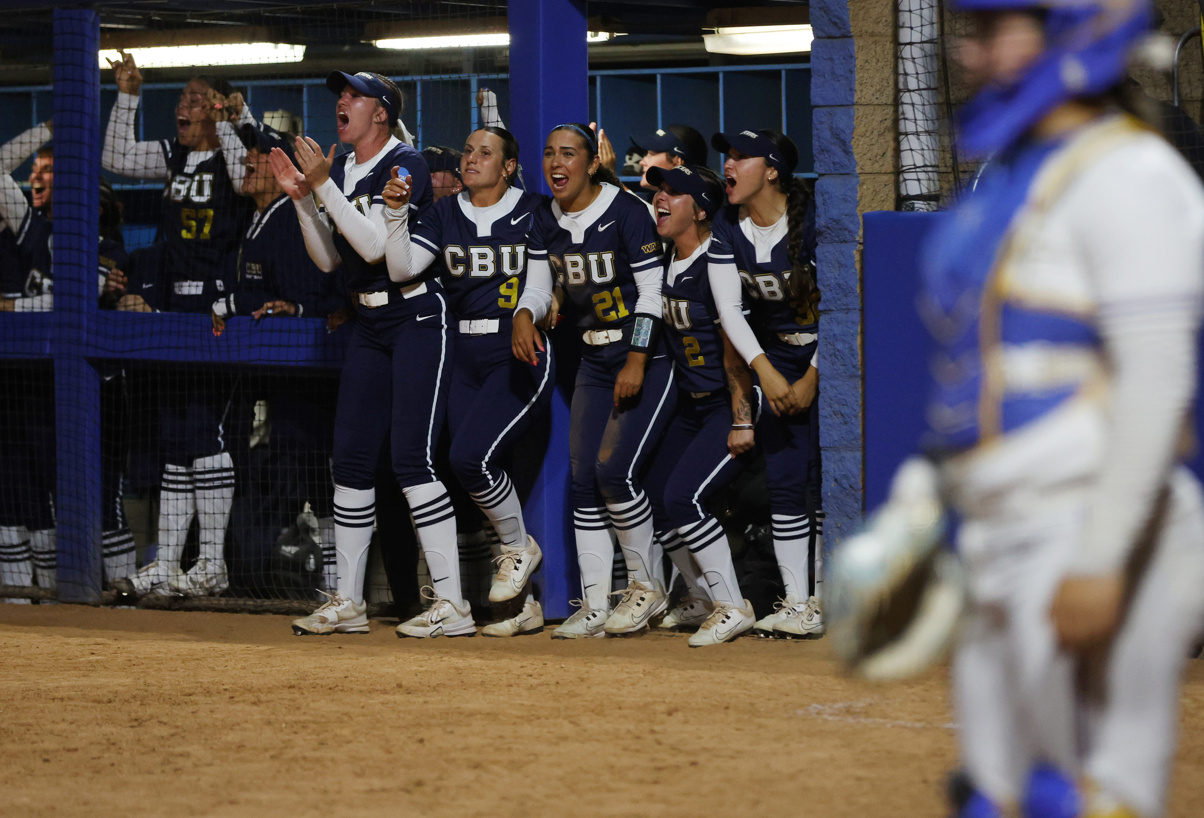 Players in the California Baptist dugout celebrate during their 10-run...
