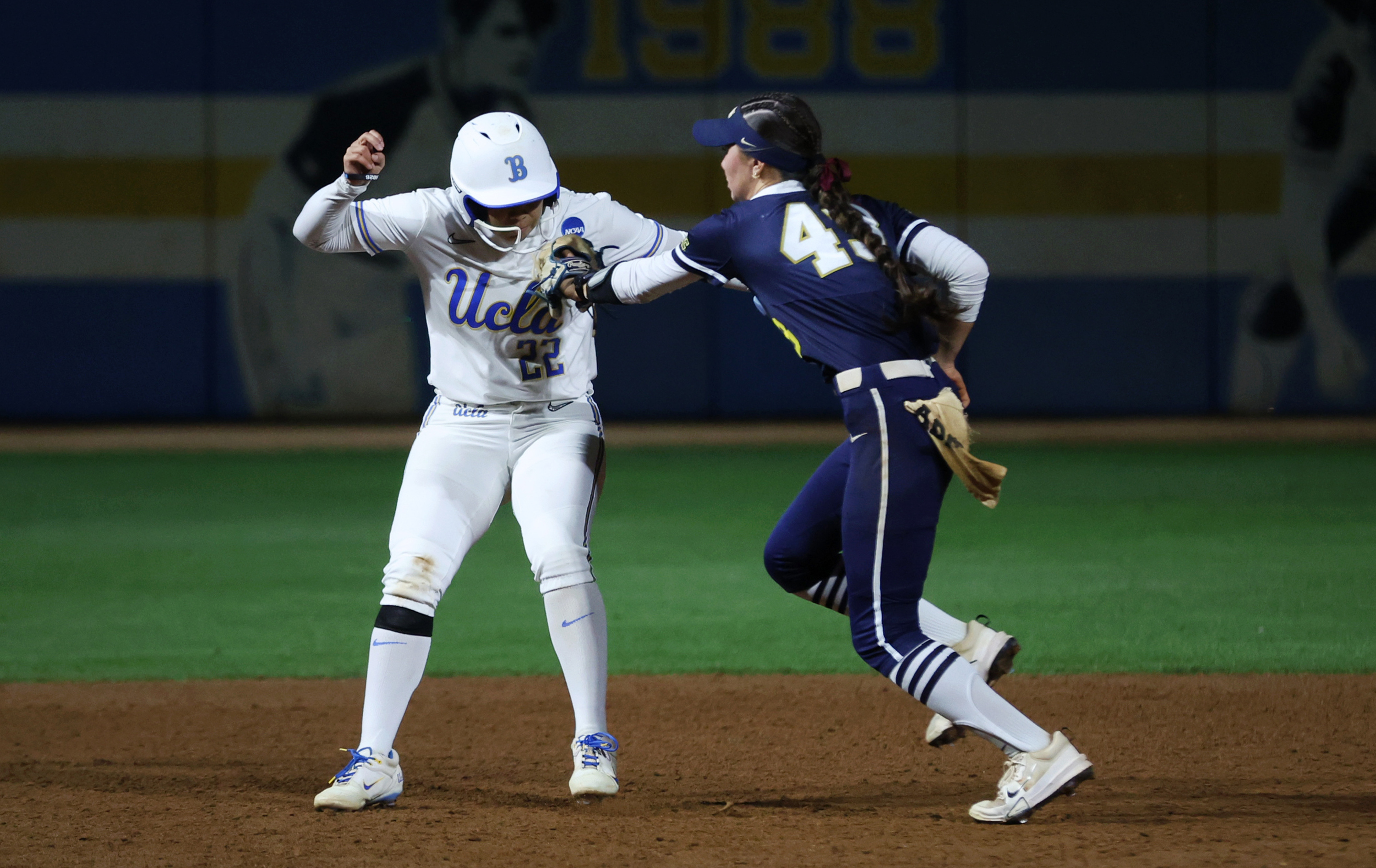 UCLAâs Bri Alejandre, left, tries to avoid being tagged by...