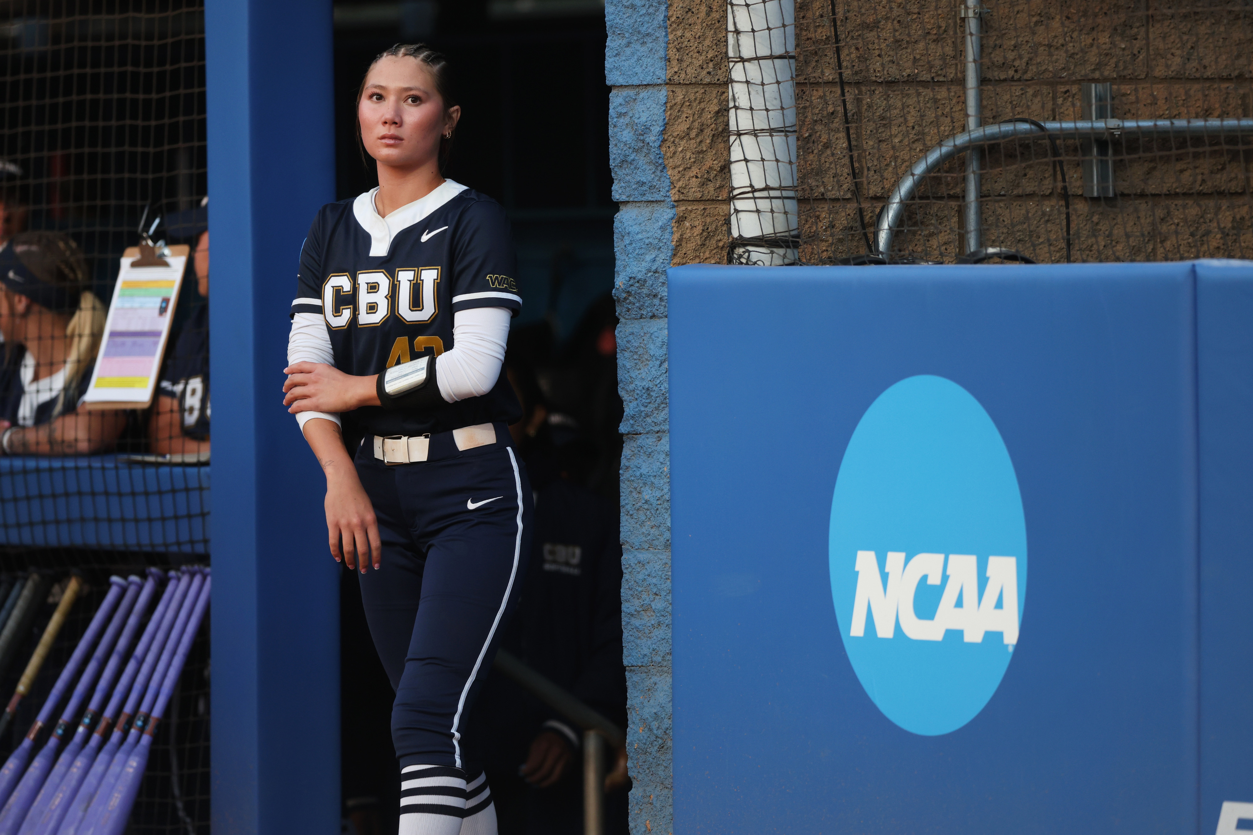 California Baptistâs Kenzie Farrier-Pilon walks out of the dugout before...