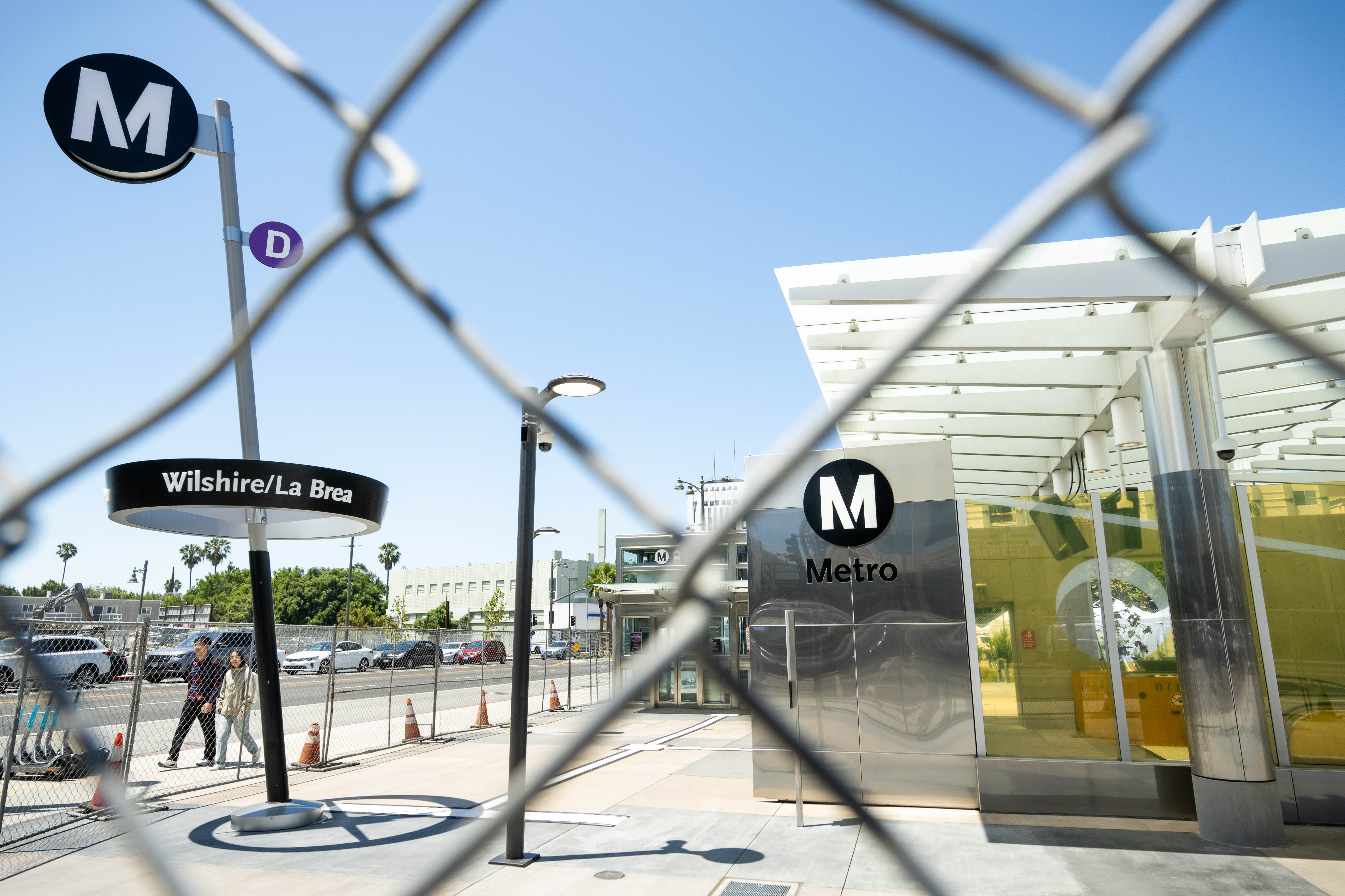 People walk past the Metro D Line subway extensionâs Wilshire/La...