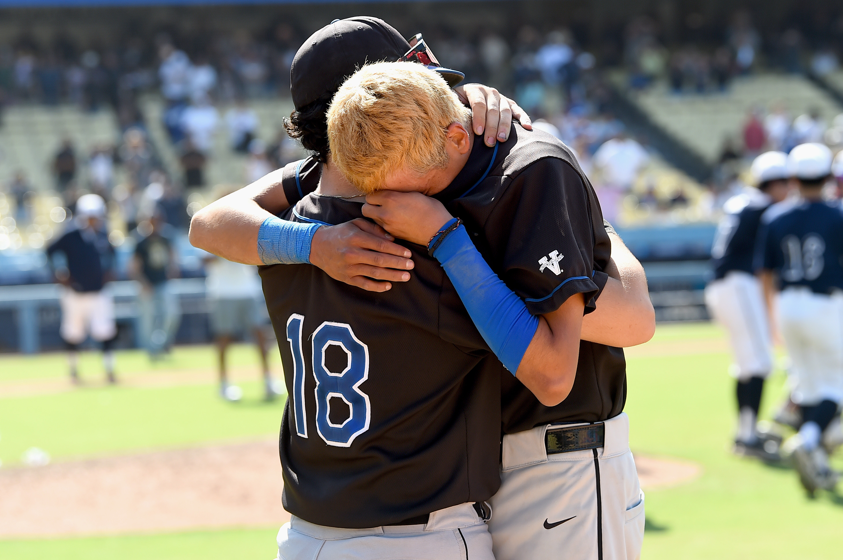 El Camino Real players console one another after a loss...