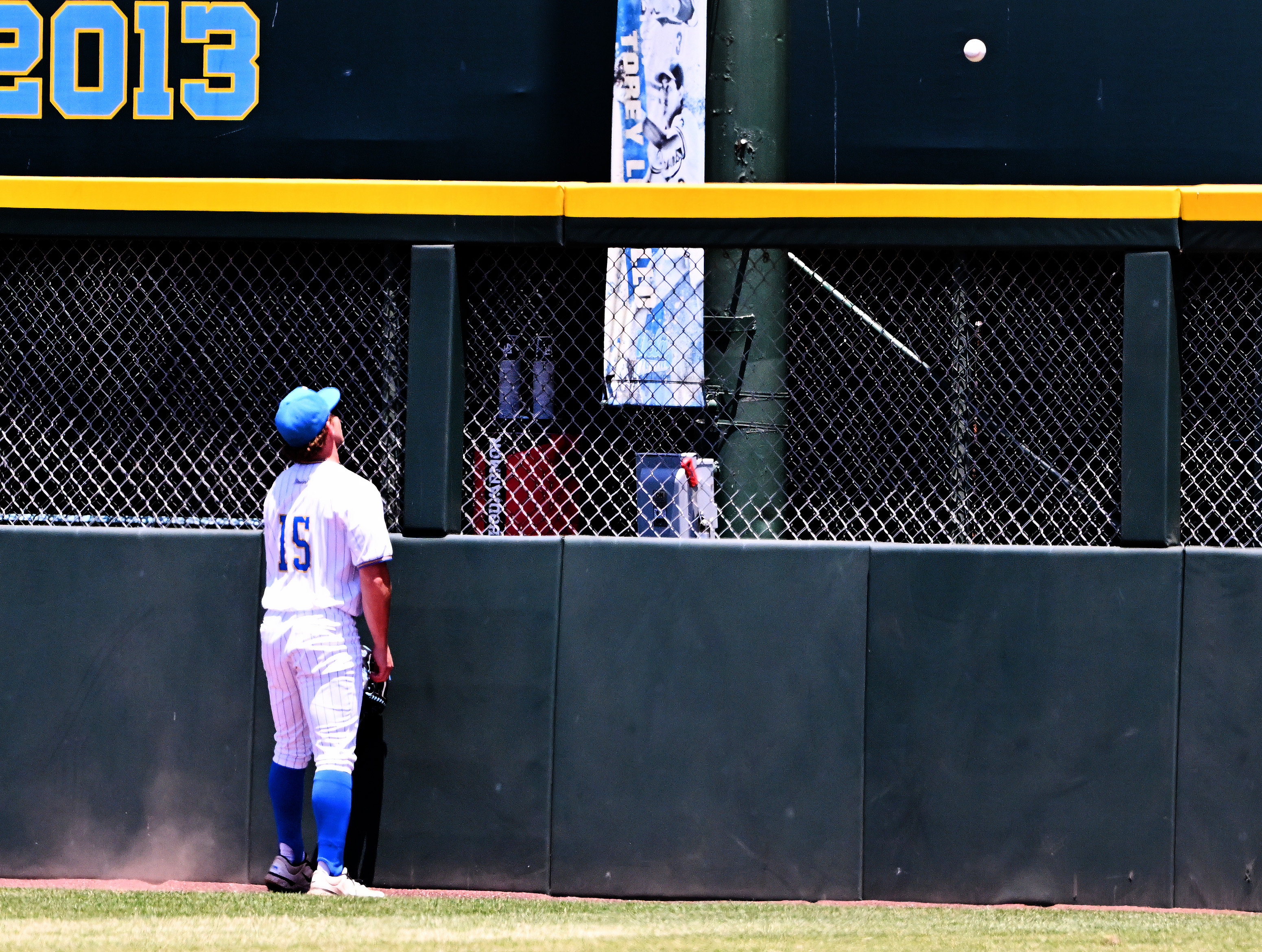 Right fielder Jarrod Hocking #15 of the UCLA Bruins watches...