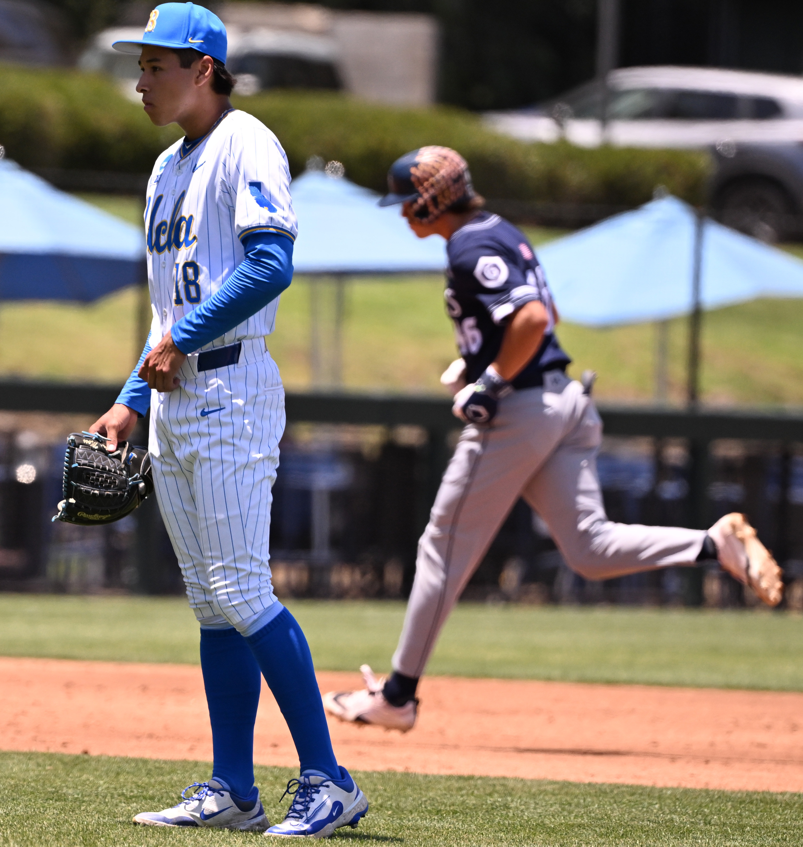 Starting pitcher Wylan Moss #18 of the UCLA Bruins looks...