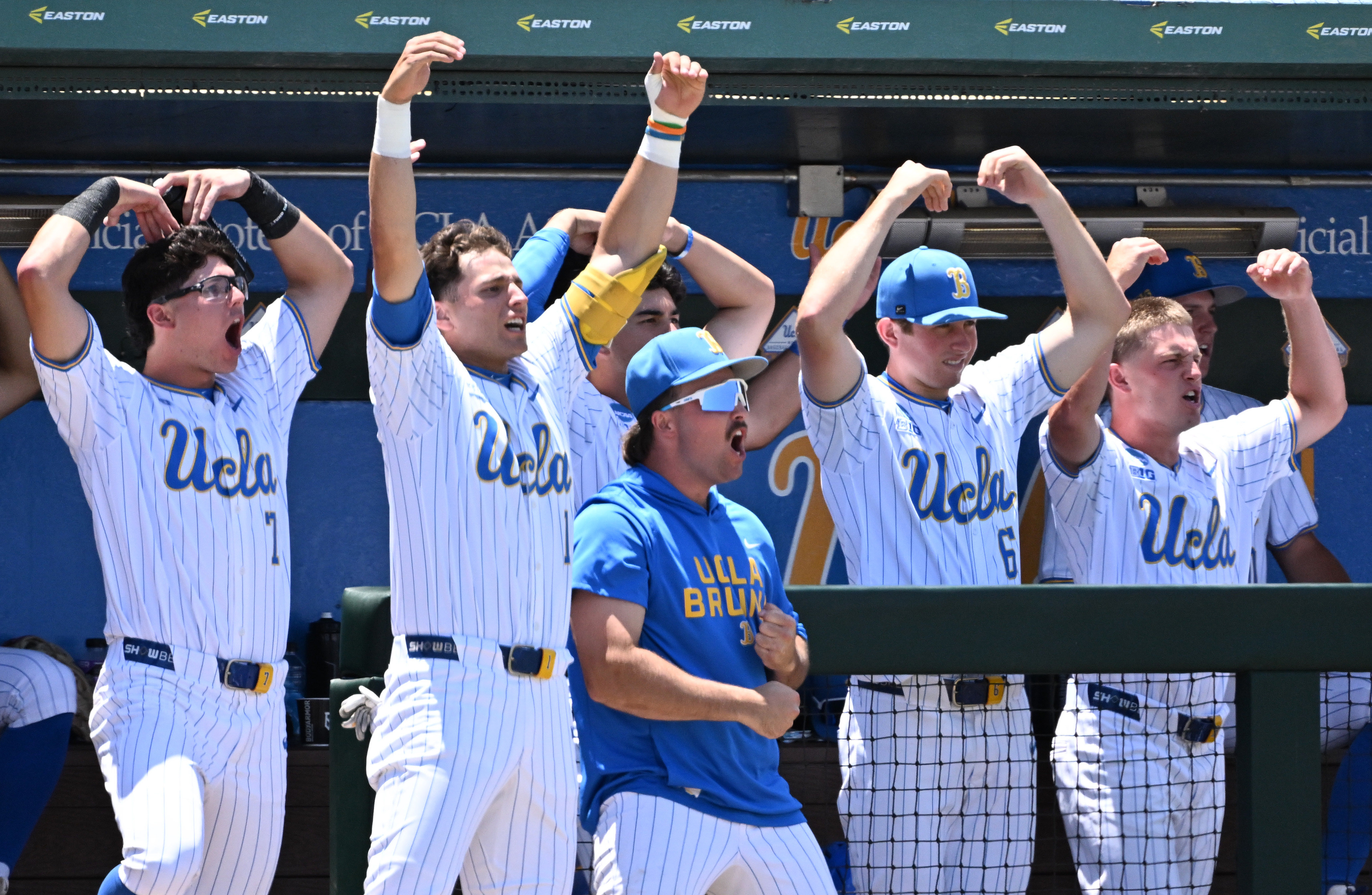 UCLA Bruins bench reacts after teammate Trey Gudoy (not pictured)...