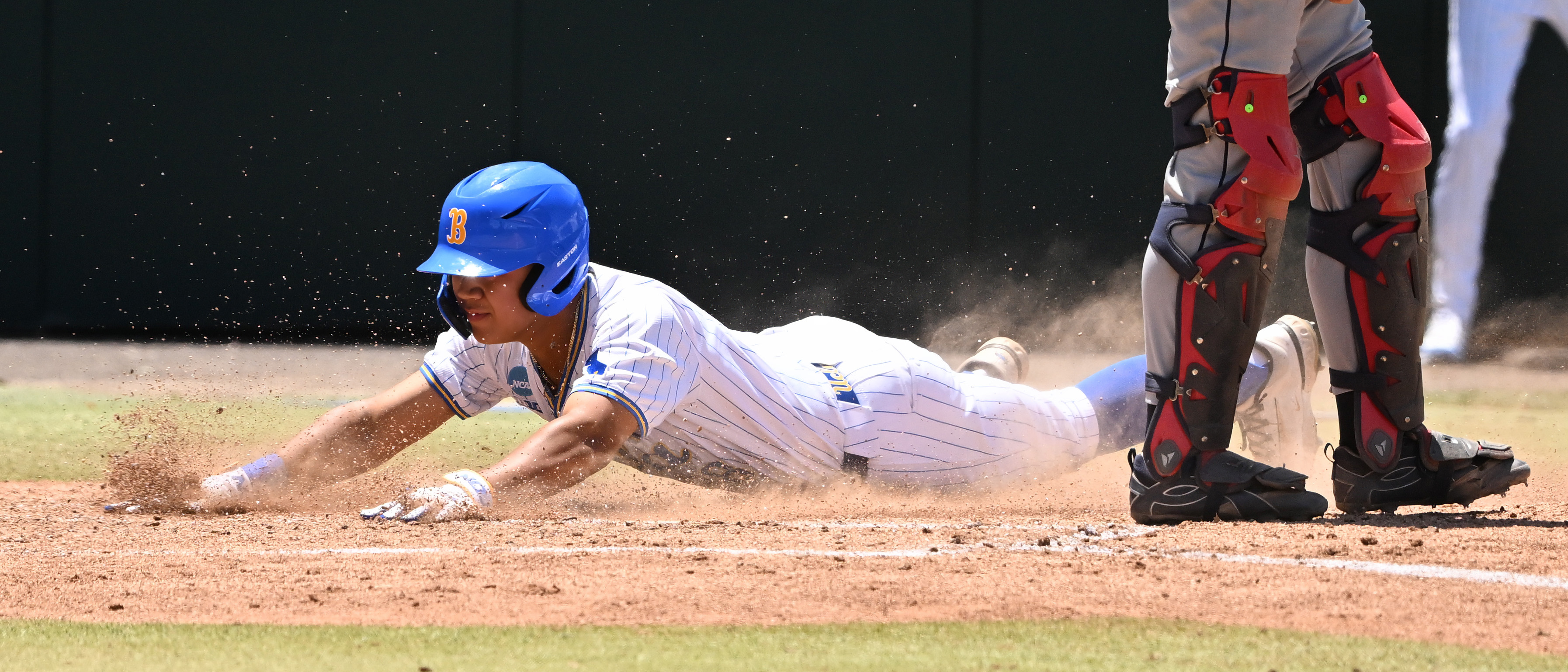 Trey Gudoy #38 of the UCLA Bruins scores on a...