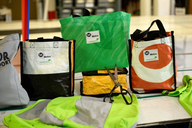 CR+A Custom upcycles old Metro vinyl banners and uniforms into tote bags in their workshop on West Pico Boulevard. (Photo by Jacob Lewis, Contributing Photographer)
