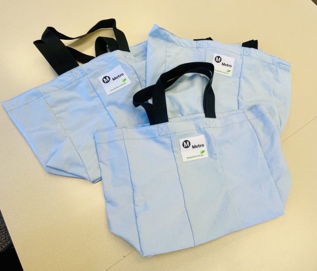 The newest repurposed tote bags are made from employee uniforms. These were made from bus operator shirts. (photo courtesy of LA Metro).