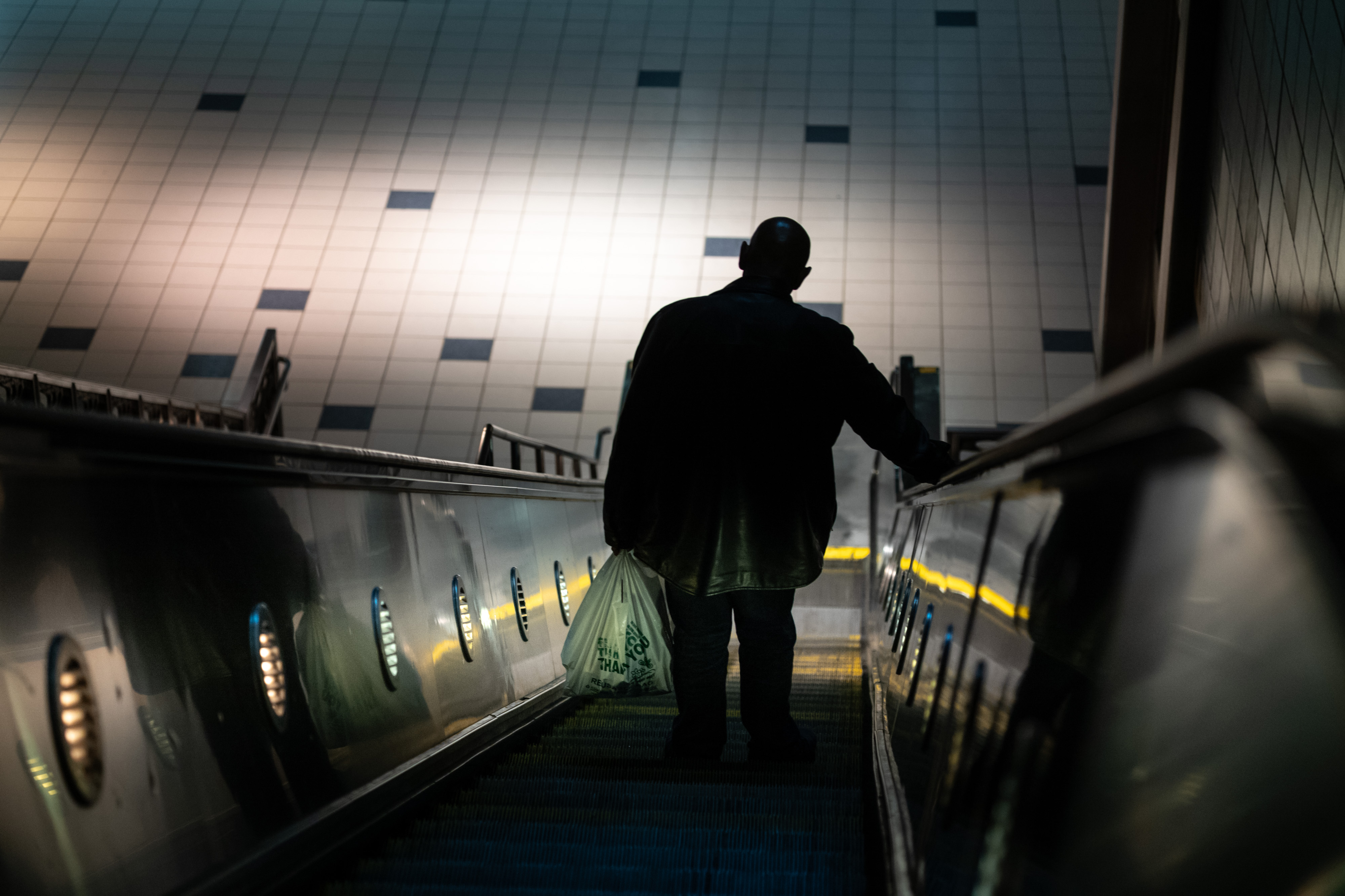 A metro rider heads down to the B line train...
