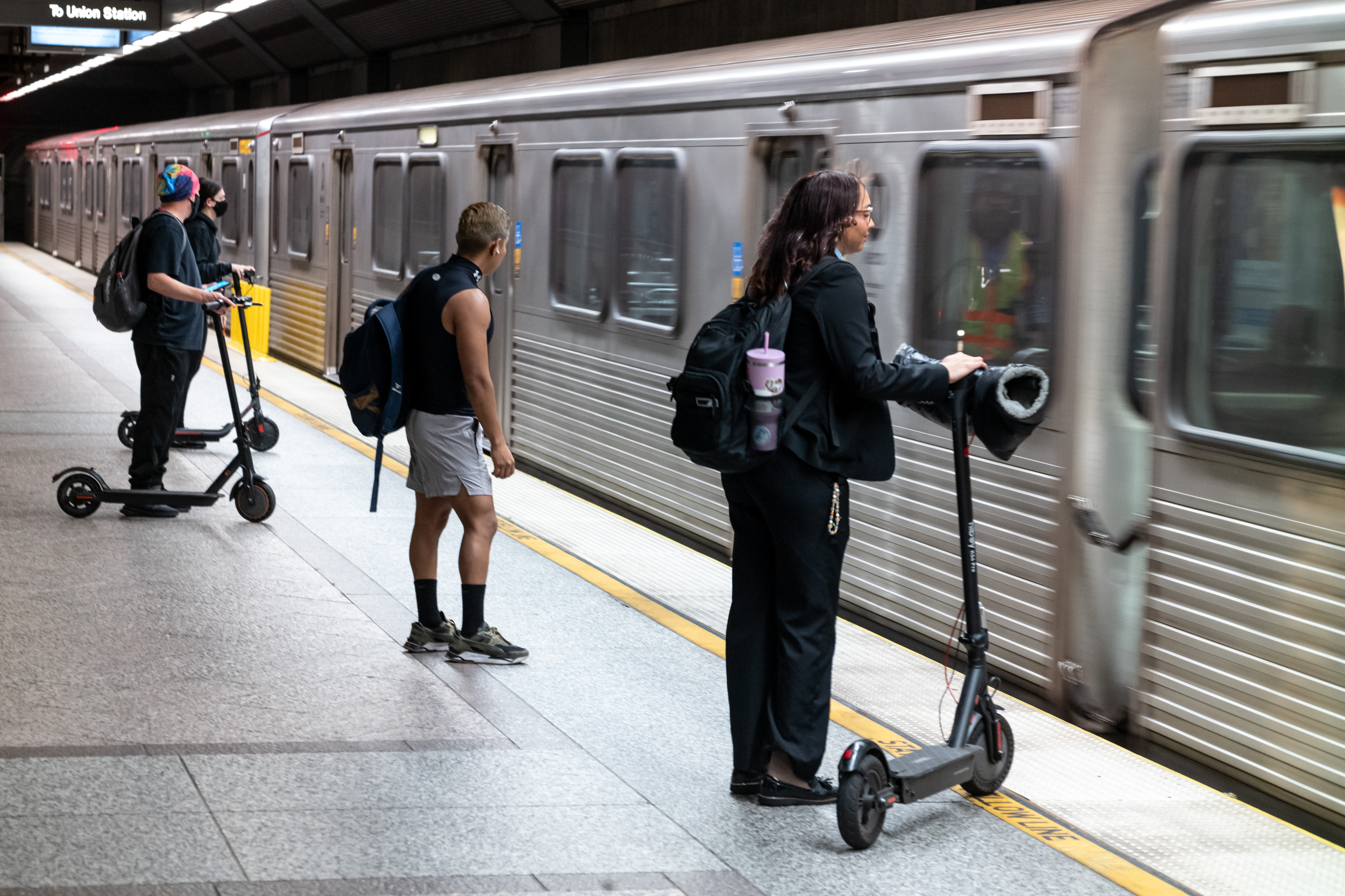LA Metro riders wait for the subway train at the...