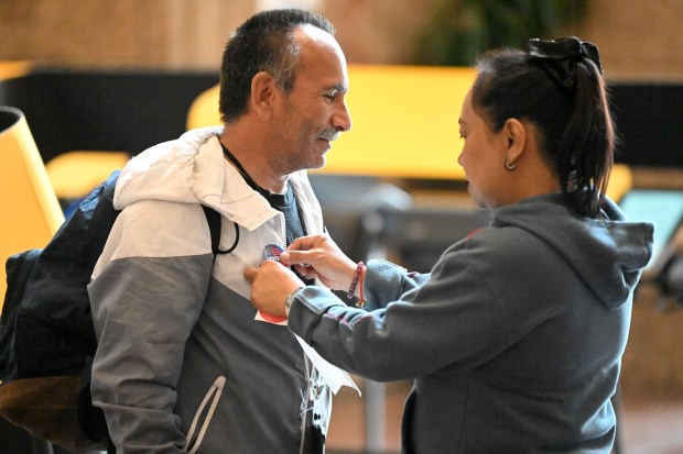 Albert Anthony Pompa gets his "I Voted" sticker from election worker Yvonne Patriarca at Metro Headquarters in Los Angeles for the June 2nd primary election on Sunday May 24, 2026. (Photo by Axel Koester, Contributing Photographer)