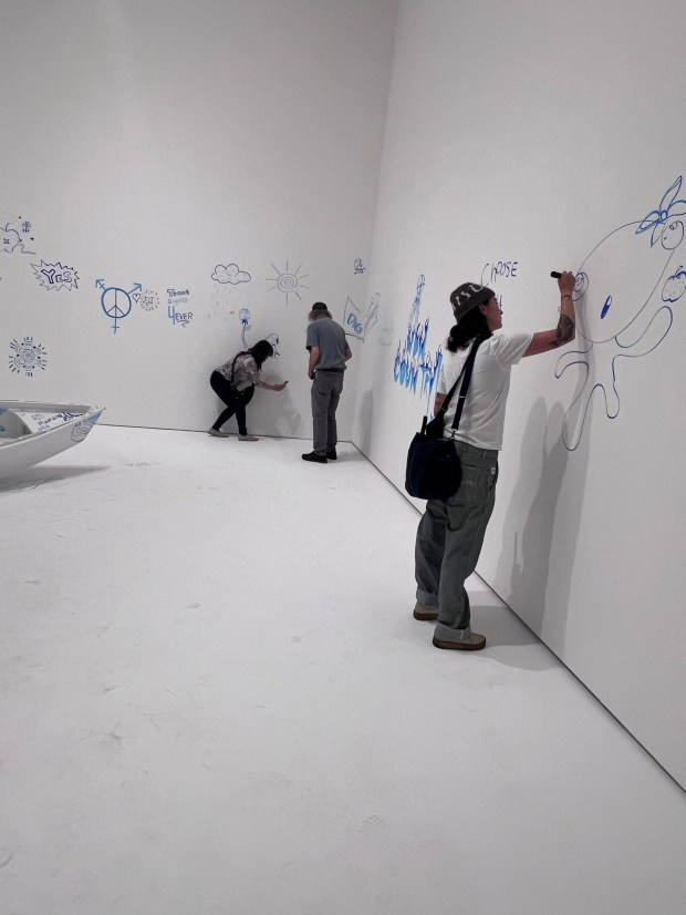 Visitors create art on a blank wall at The Broad as part of the show "Yoko Ono: Music of the Mind." (Photo by Marla Jo Fisher, Orange County Register/SCNG)