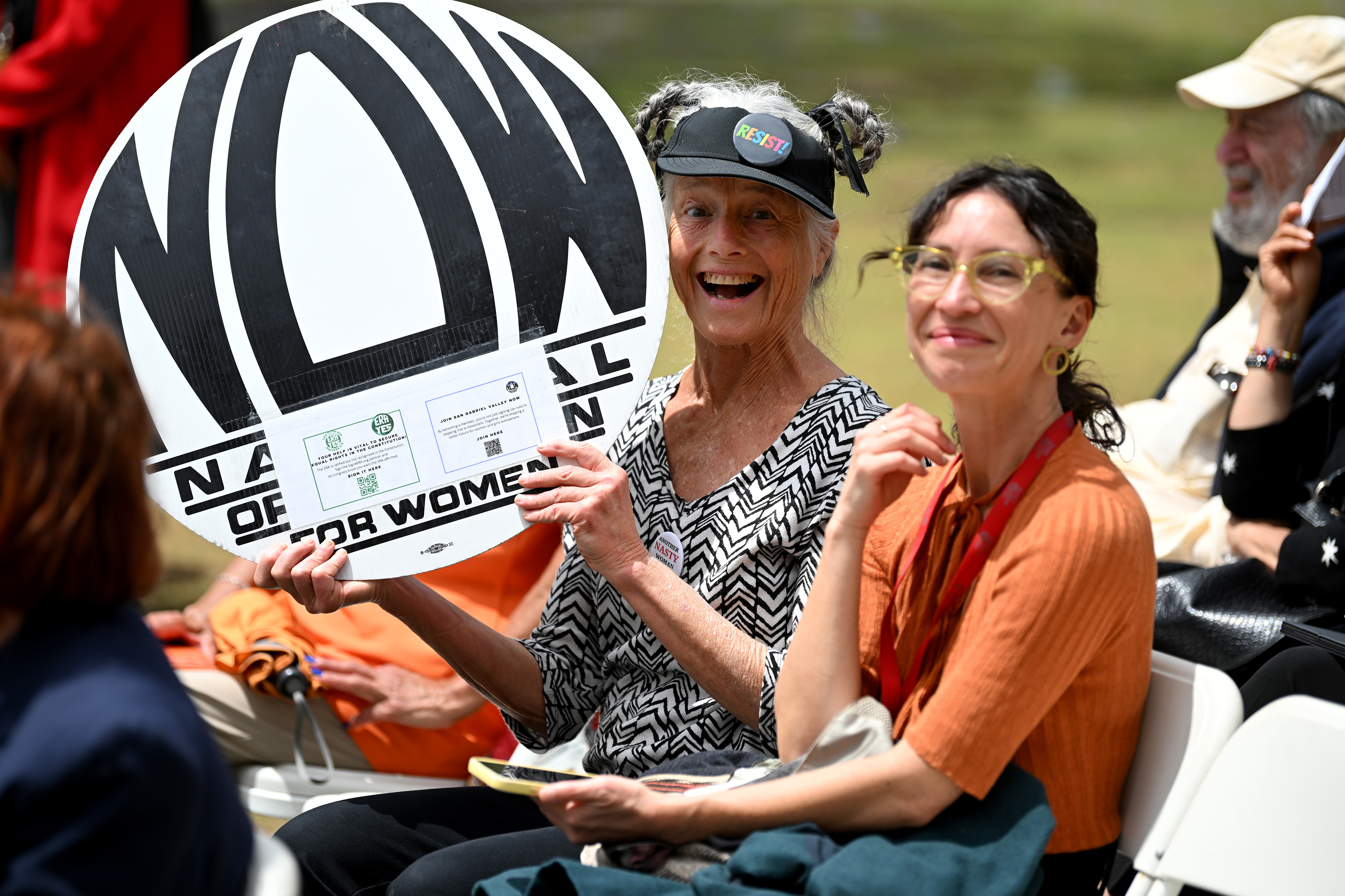 Leslie Levy holds up her sign during the Driving the...