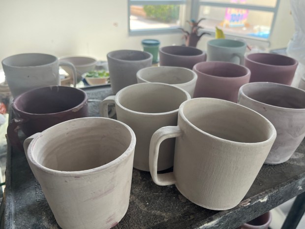 Cups crafted in La Jolla Country Day School's ceramics studio wait to be donated to formerly homeless San Diegans. (Noah Lyons)