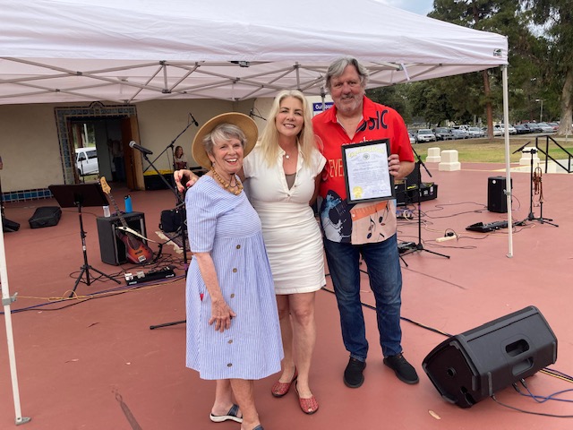 Long Beach Councilmember Kristina Duggan presents a certificate to Mary...