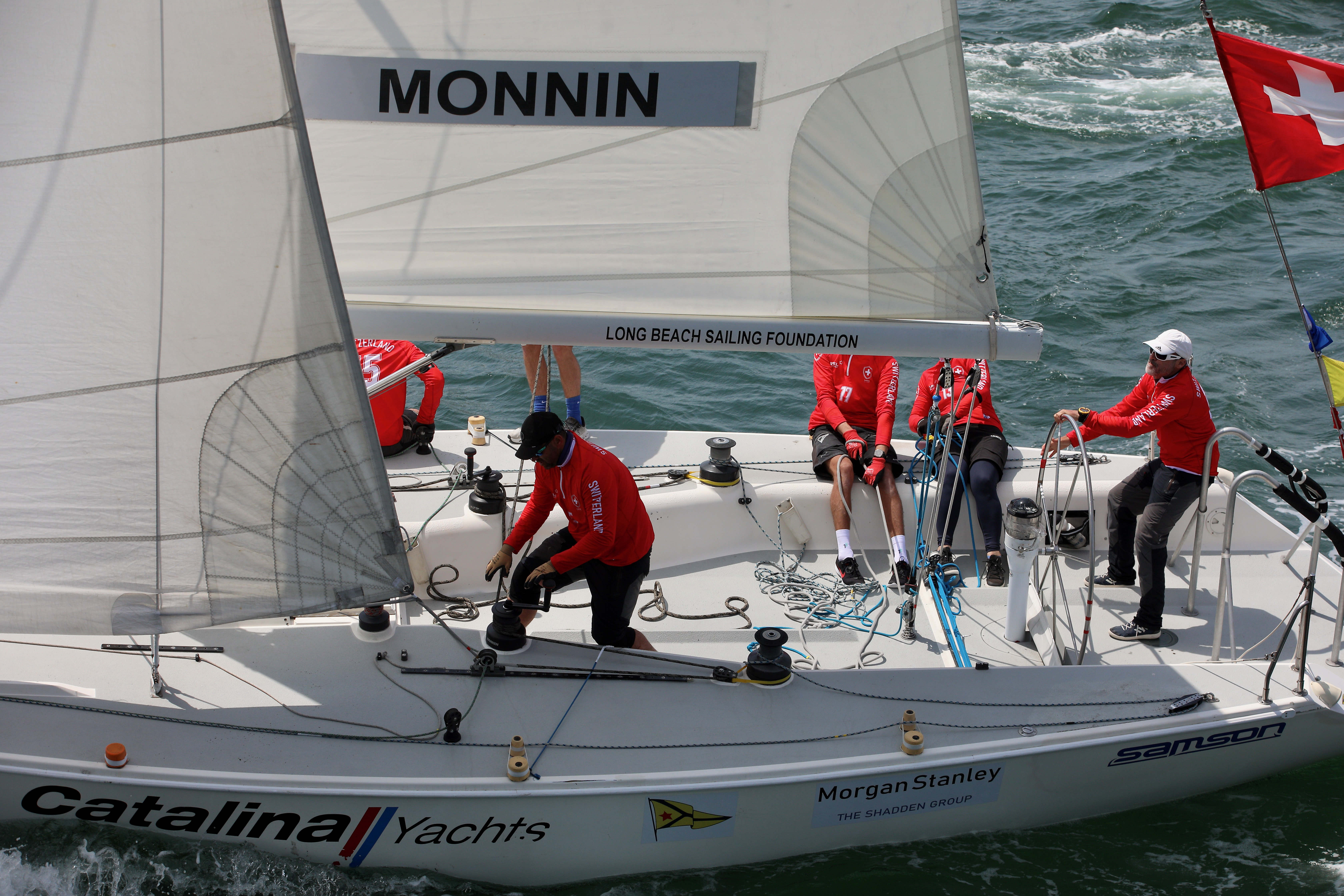 With defending champion Eric Monnin at the wheel, right, his...