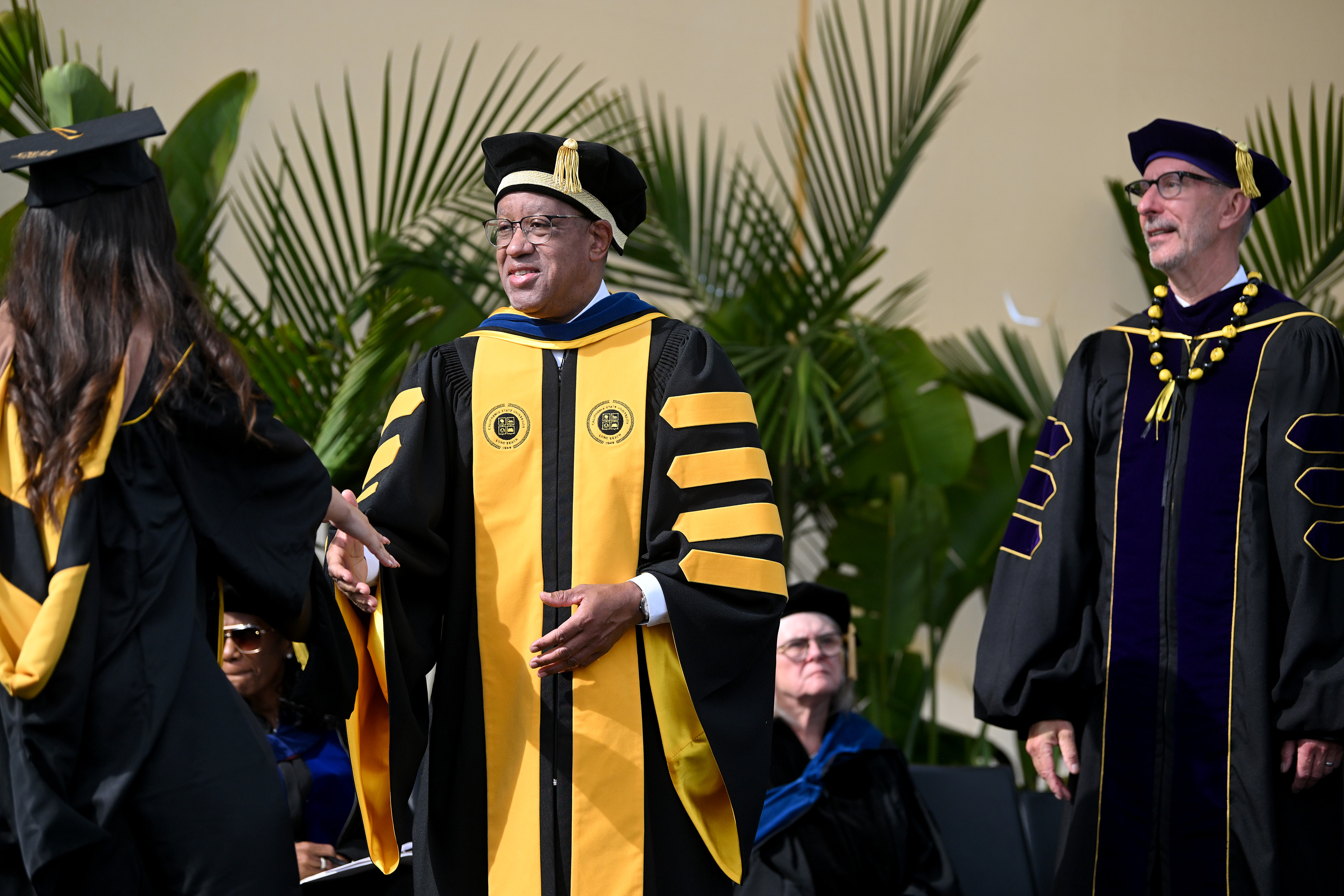 CSULB President Dr. Loren Blanchard congratulates Masters Degree graduates during...