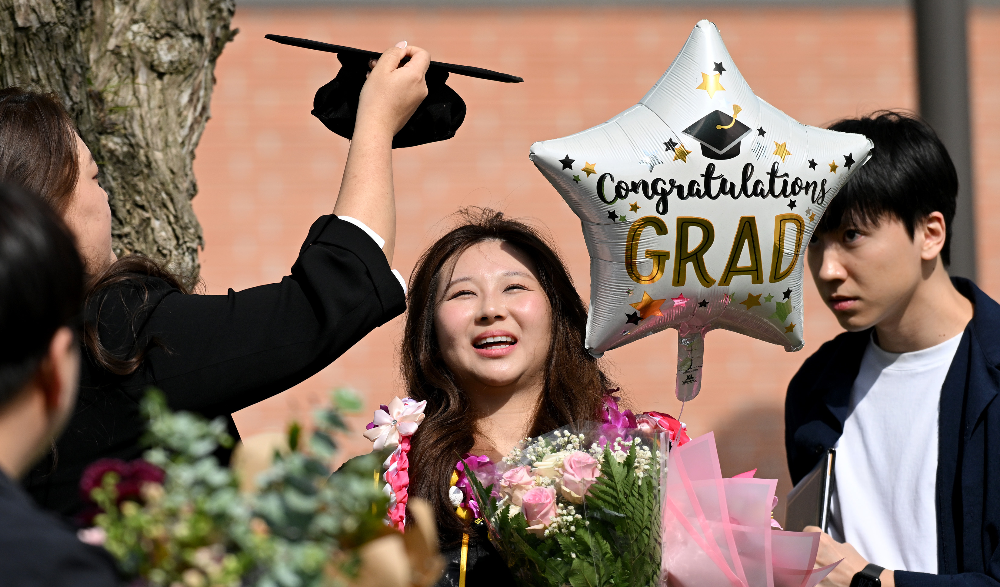 Grace Lee celebrates her Masters Degree in Finance with friends...