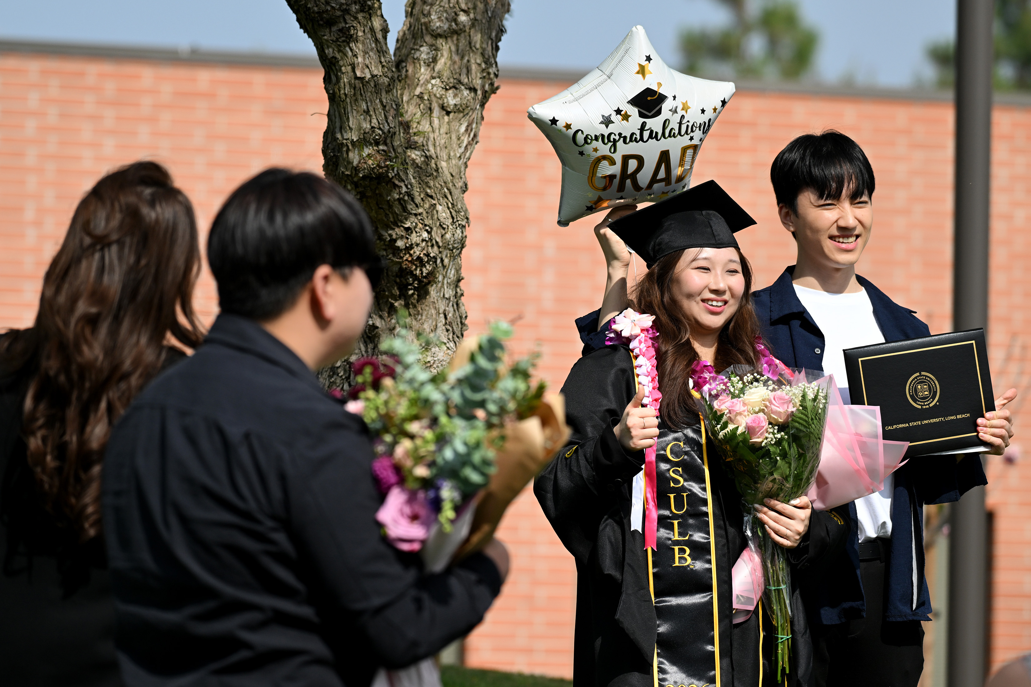 Grace Lee celebrates her Masters Degree in Finance with friends...