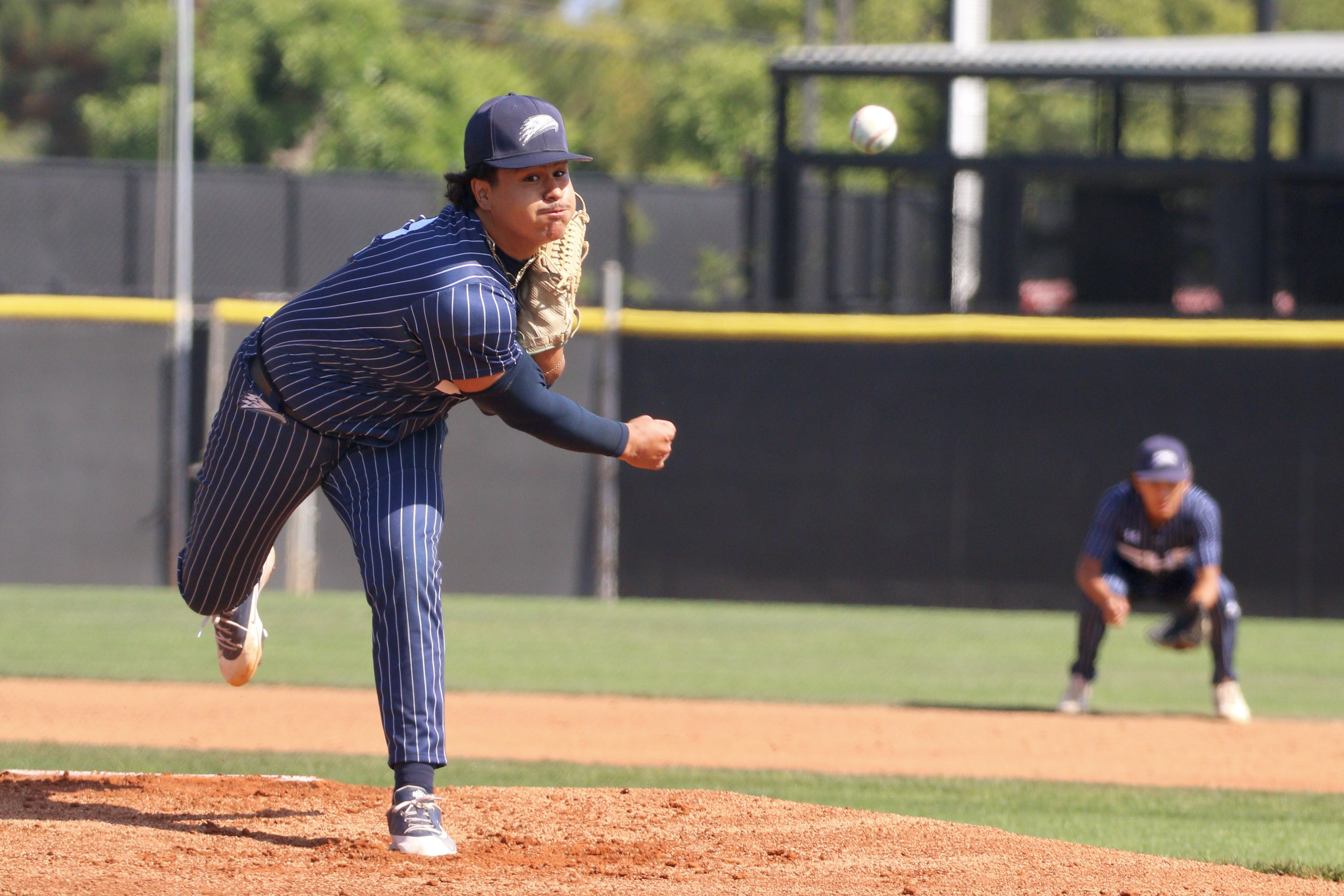 Summit starter Mario Flores pitches against Millikan in Division 3...