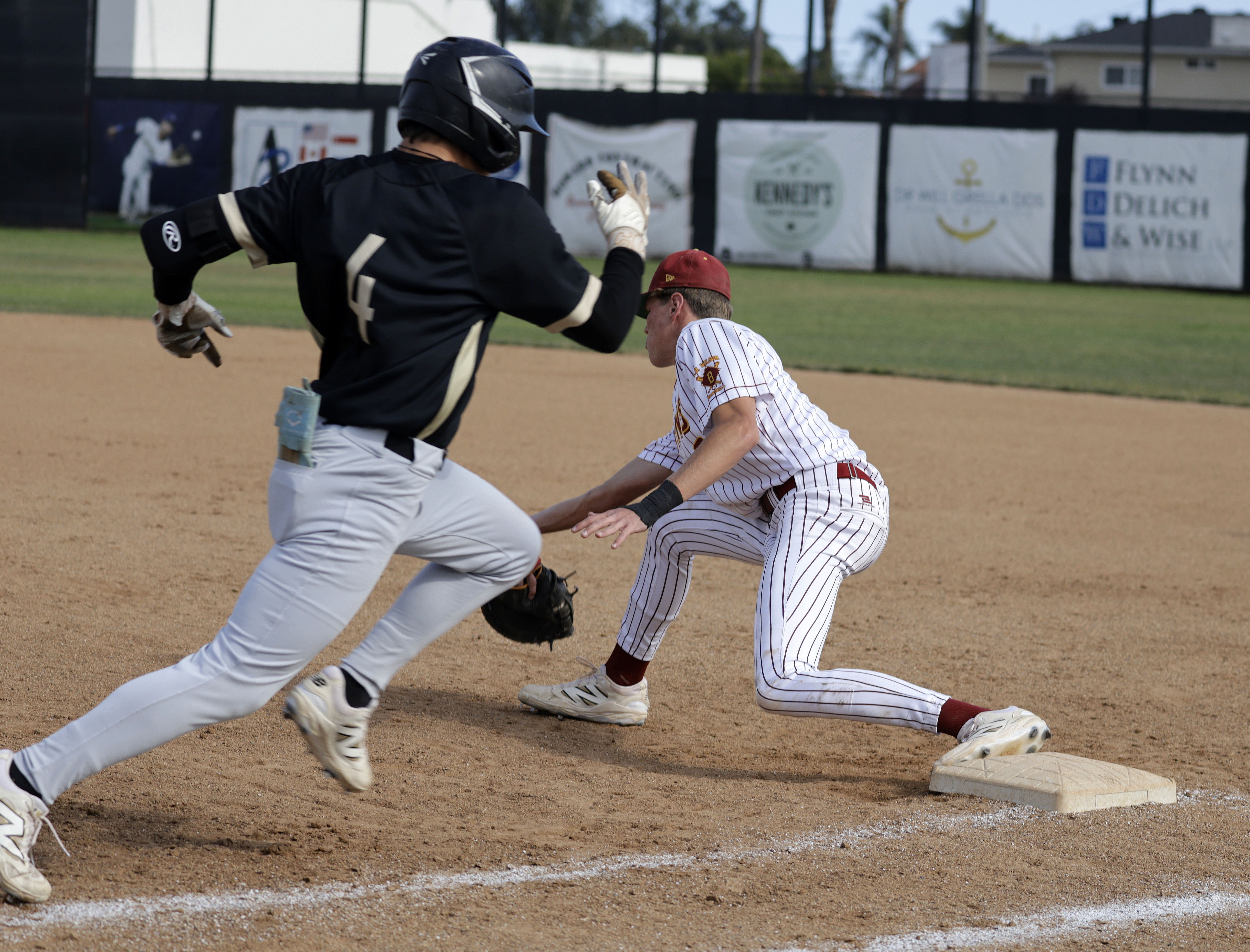 Long Beach Poly’s Az Zuger (4) races for first as...
