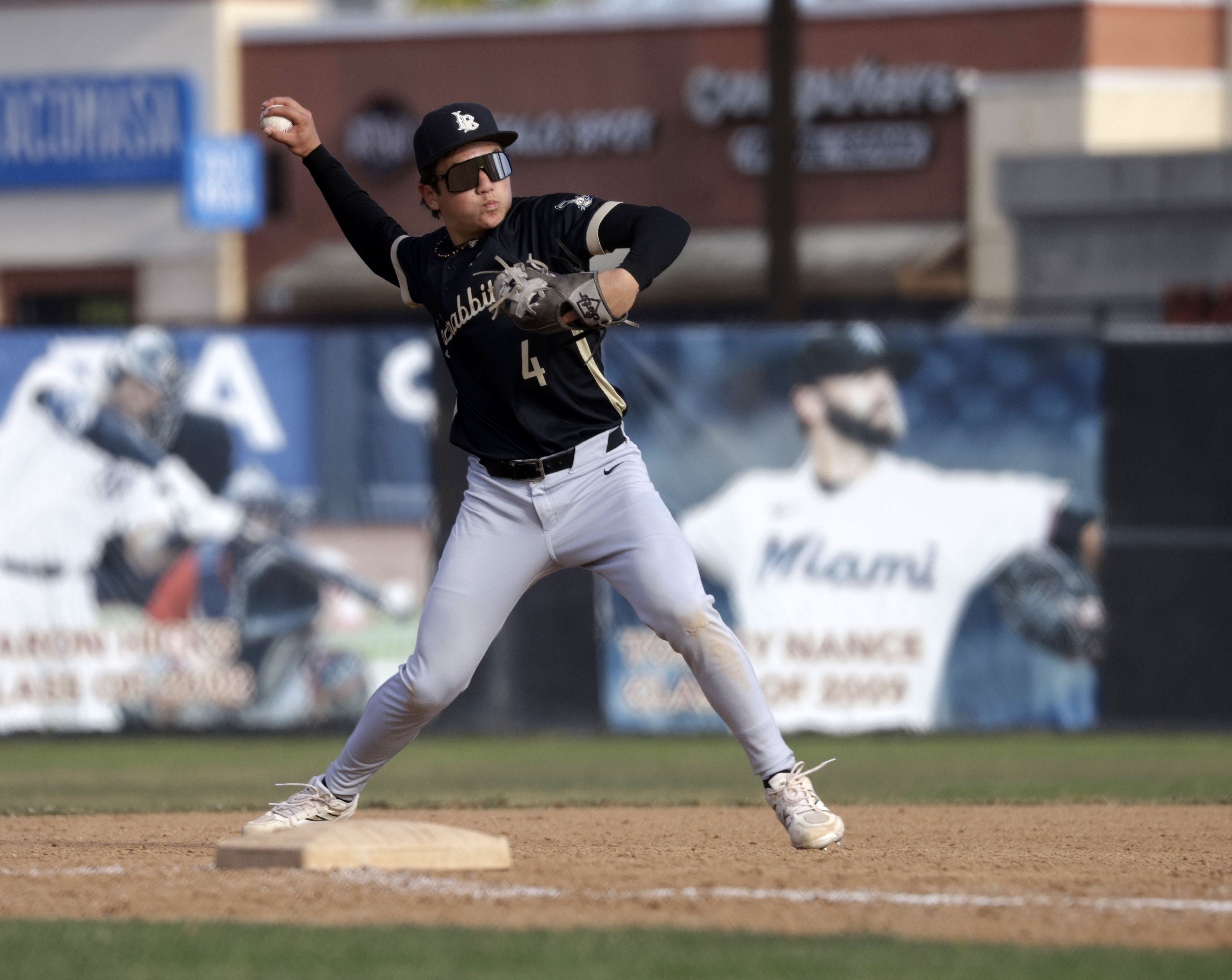 Long Beach Poly’s Az Zuger turns to throw the out...