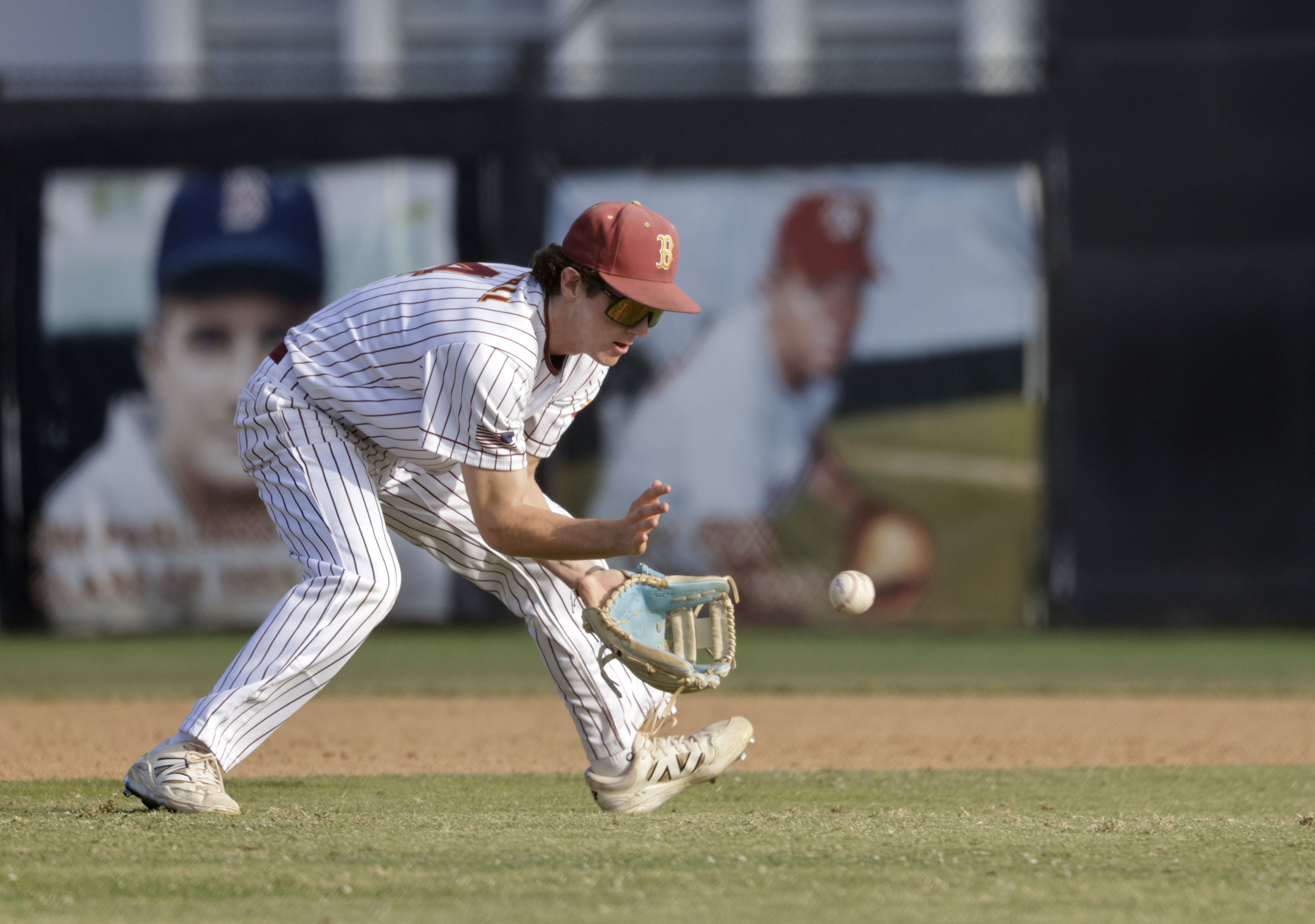 Wilson’s Jake Marshall (4) grounds the ball as the Bruins...