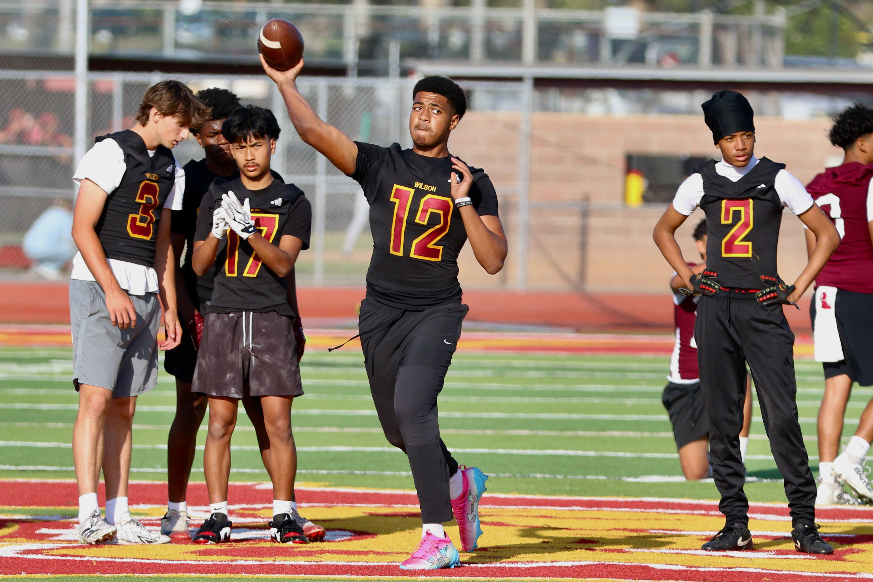 Wilson quarterback Jacob Powell gets a throw in during a...