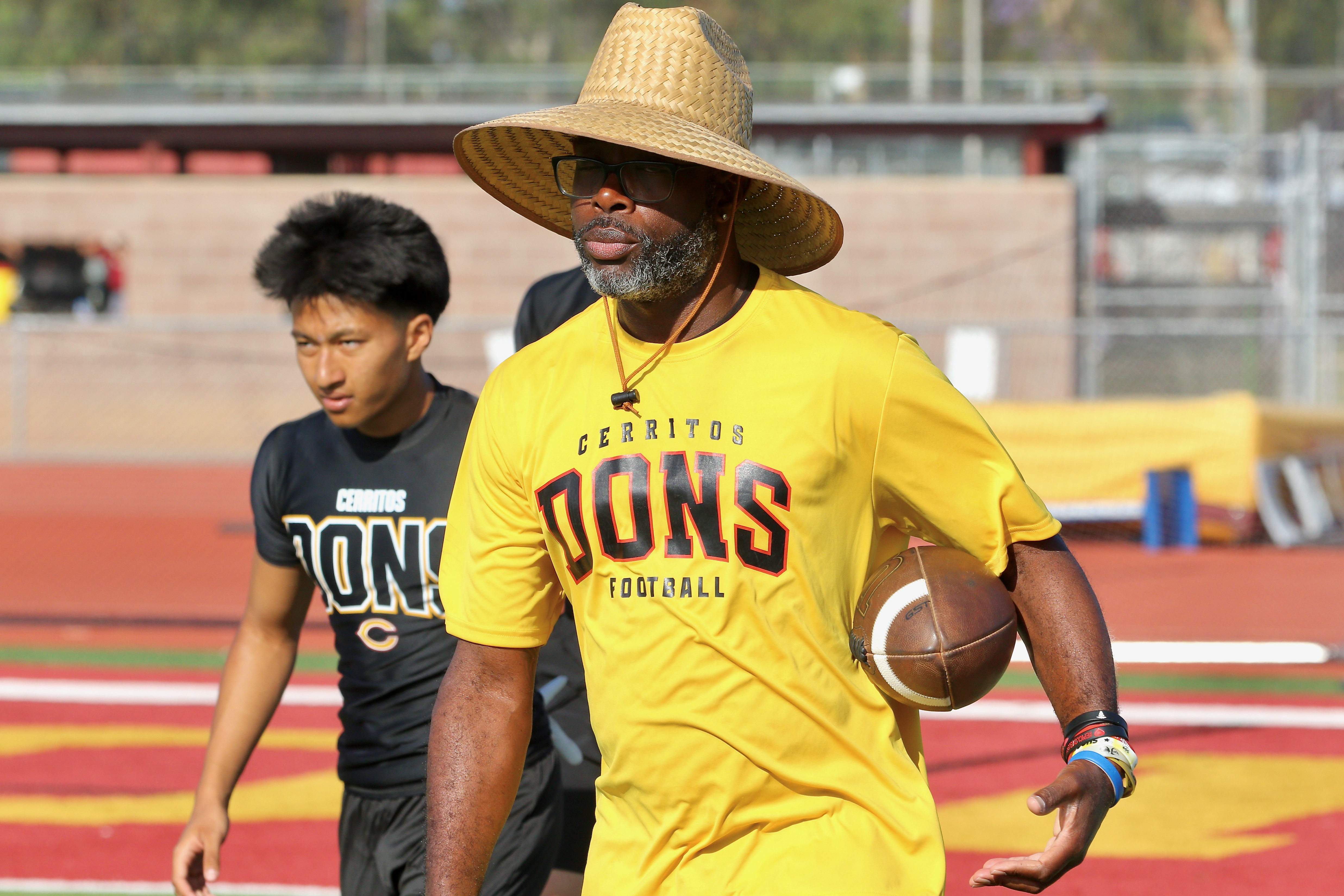 Cerritos head football coach Demel Franklin looks on during a...
