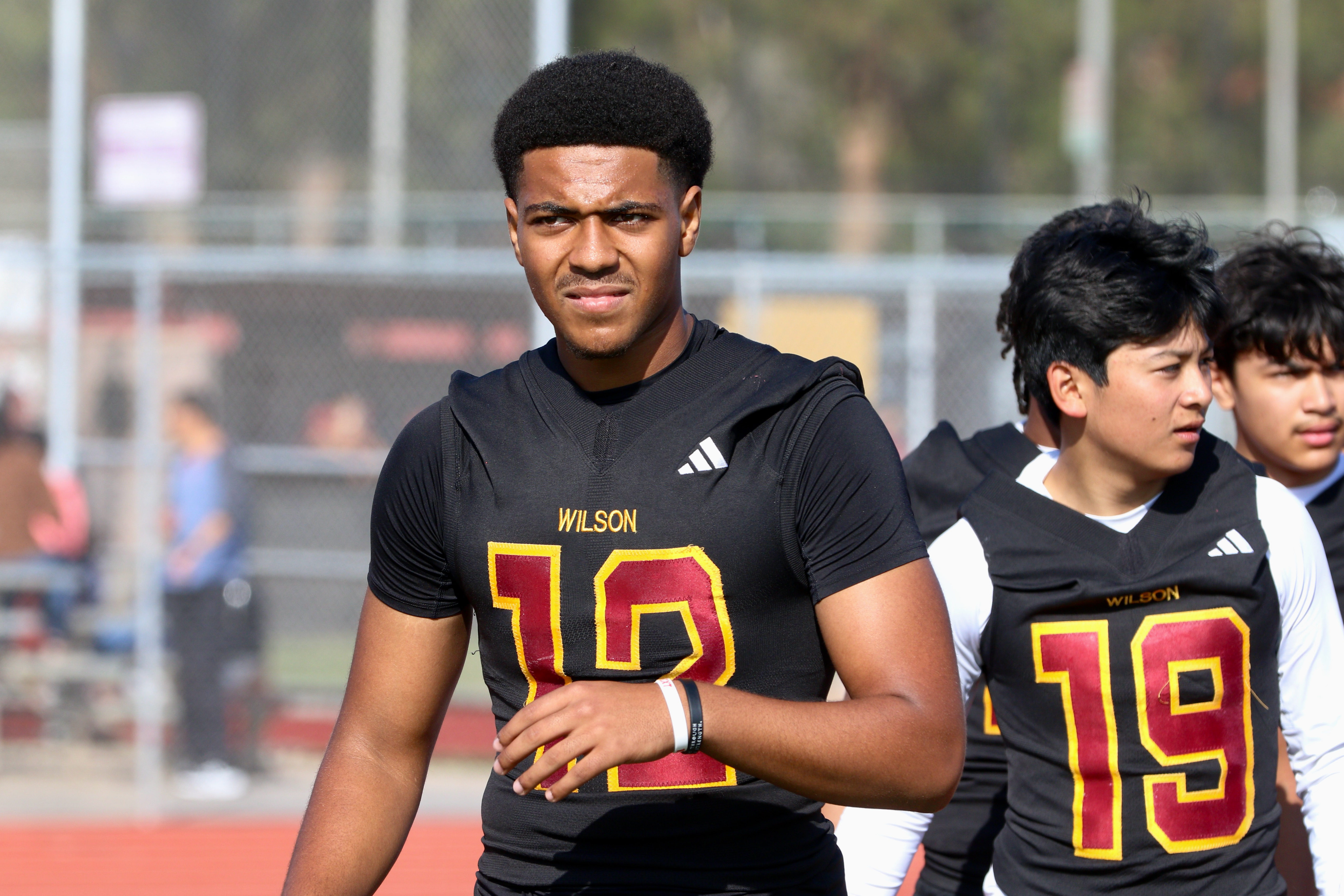 Wilson quarterback Jacob Powell takes part in a spring football...
