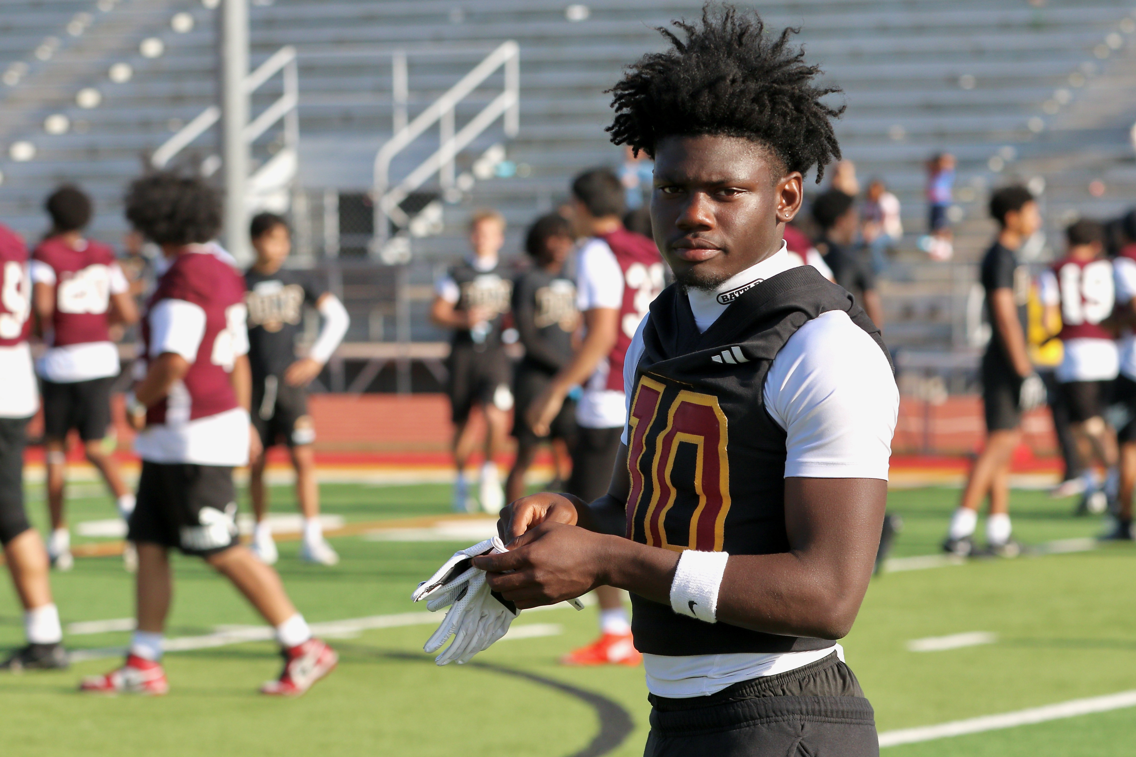 Wilson running back / defensive back Jemel Grigsby takes part...